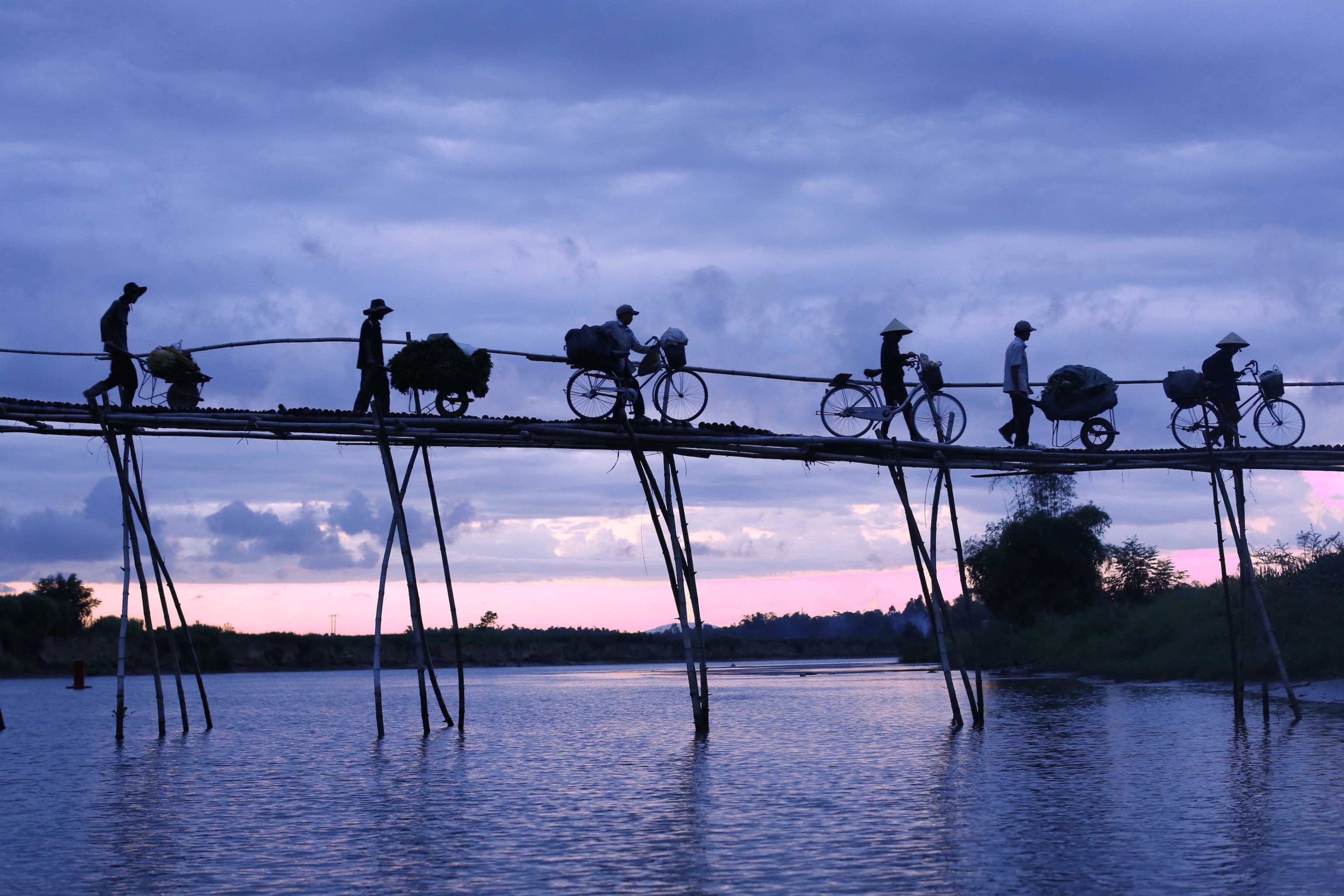 bikes on bamboo bridge in Quang Nam, Vietnam