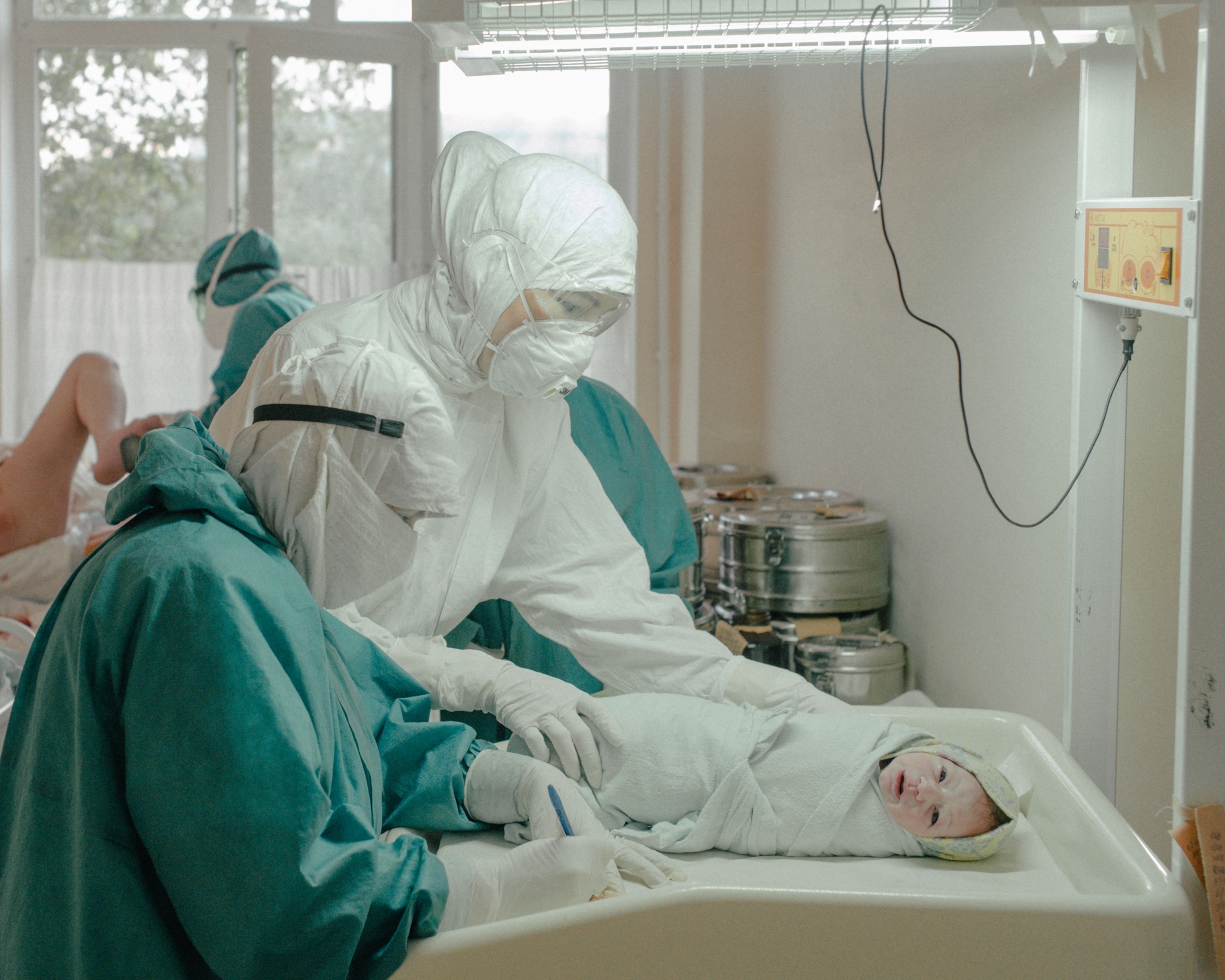 doctors in Dagestan, Russia tend to a newborn baby