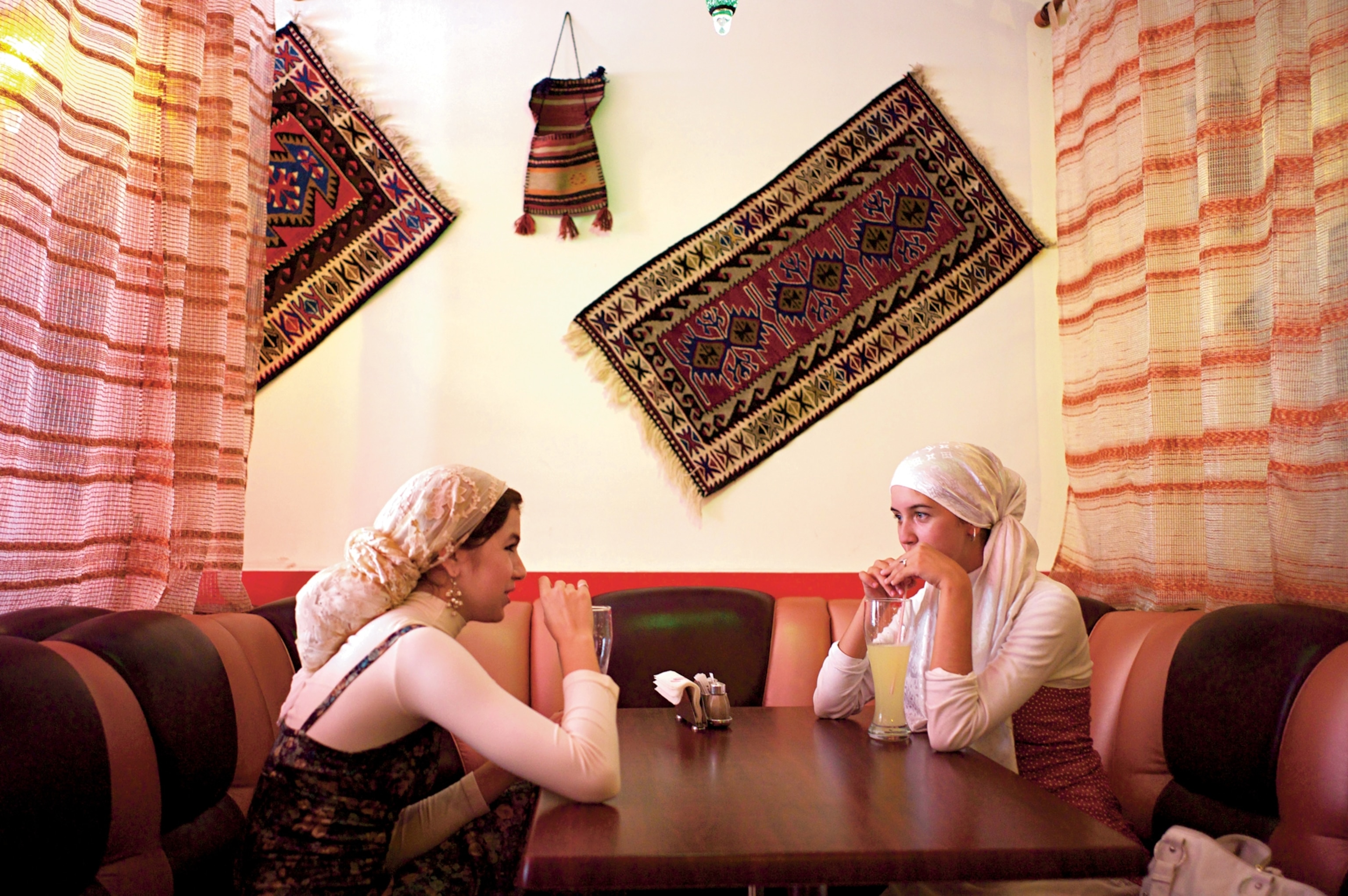 two women in Kazan, Tatarstan, sip a traditional fermented drink called kvass