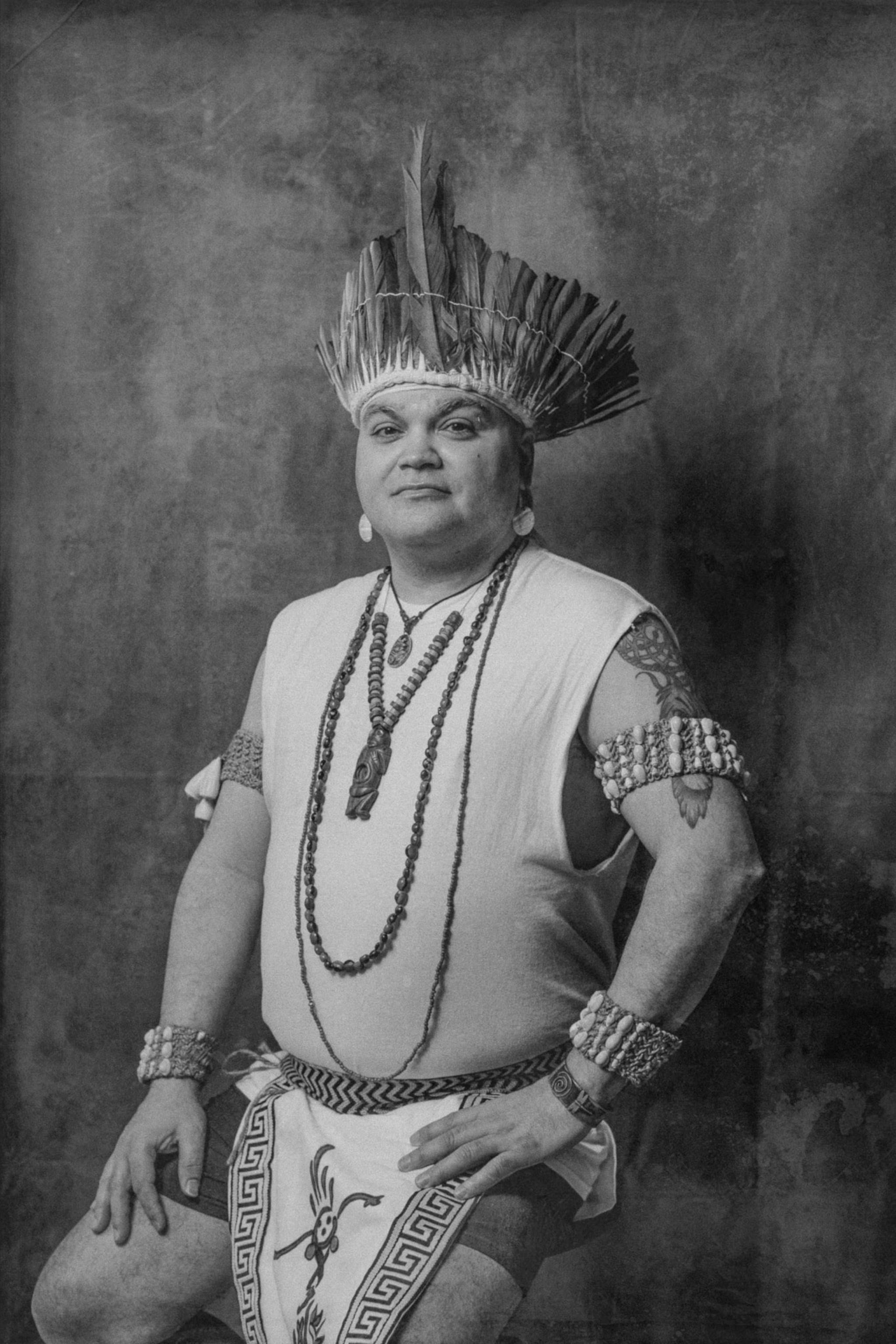 a Taíno person sitting for a portrait