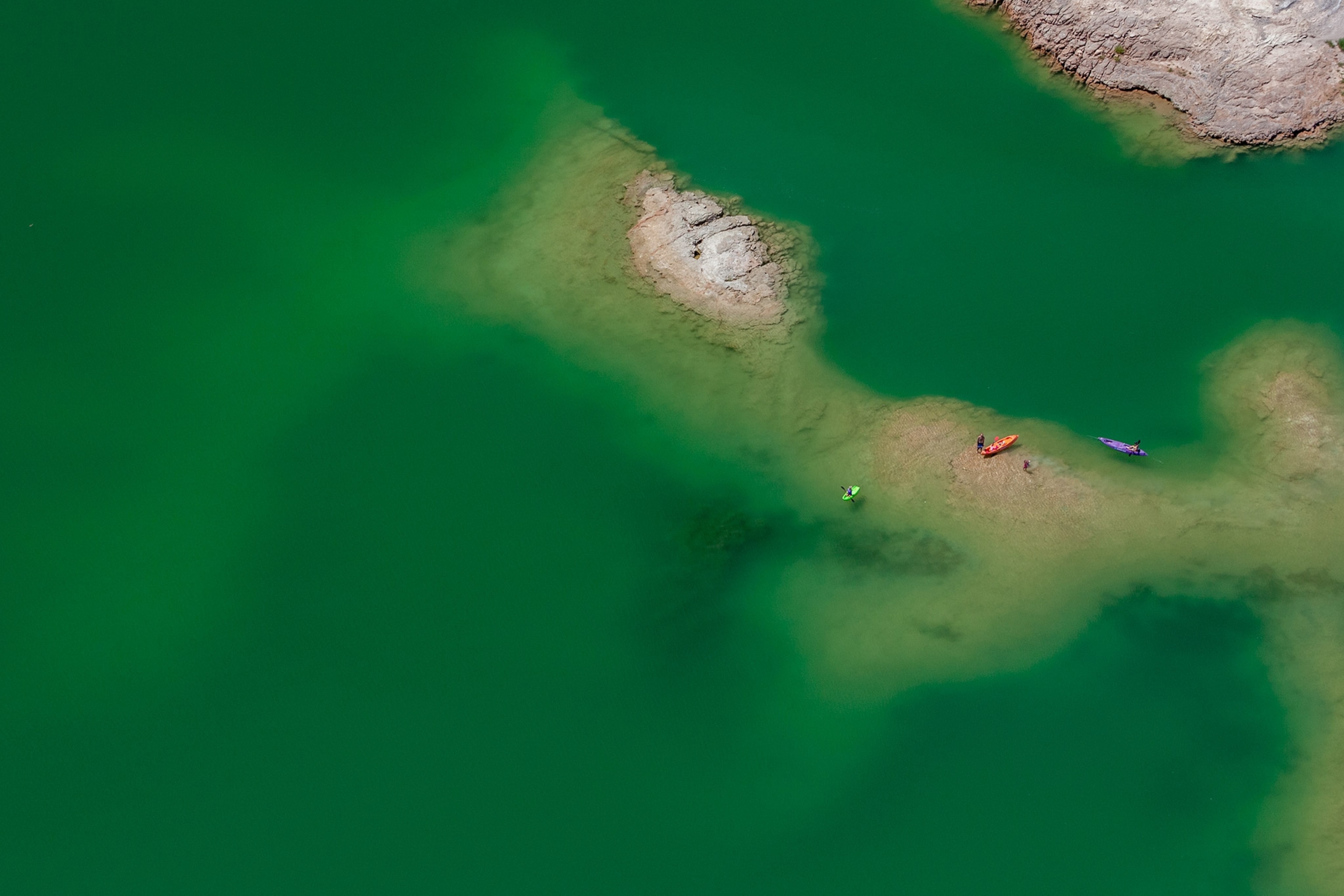 the landscape seen from the window seat of a plane over Lake Mead in Nevada