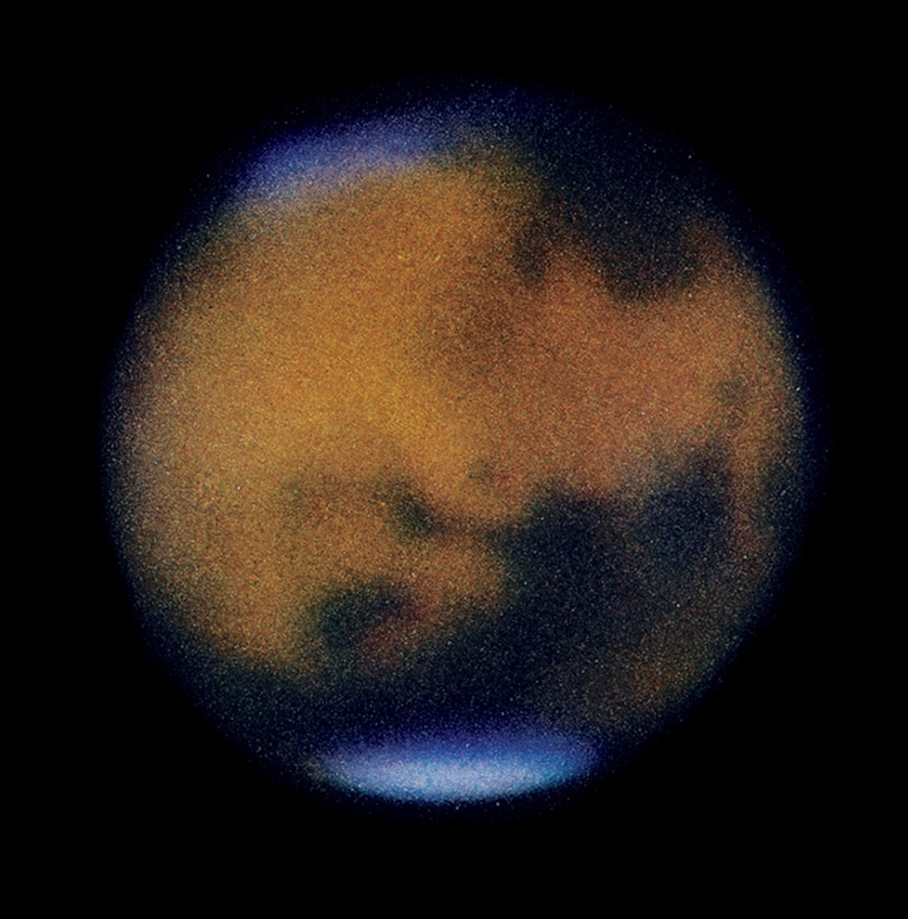 blurry photo in reddish color with dark spots.