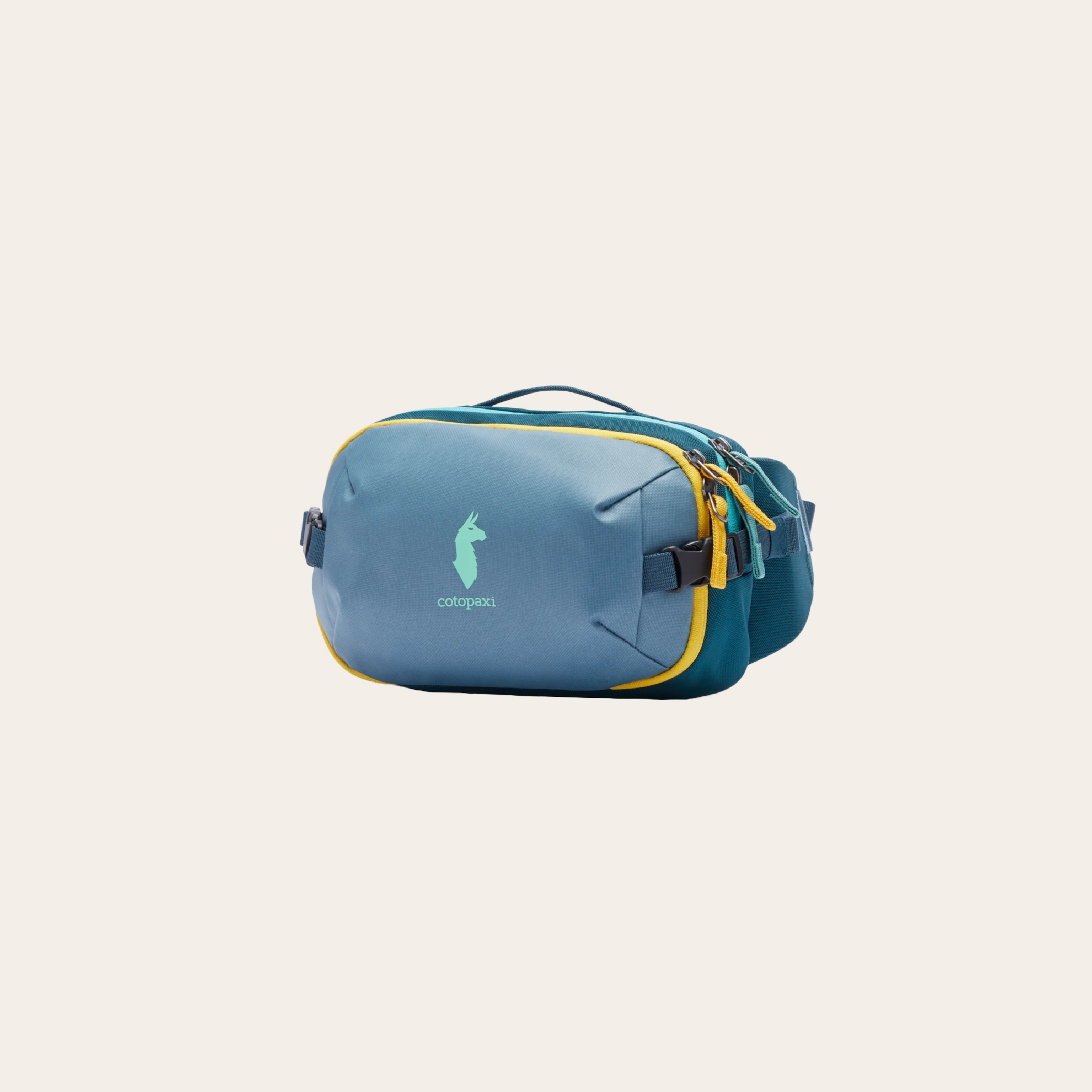 A soft blue bag with yellow zip detail oval shaped on a cream background.