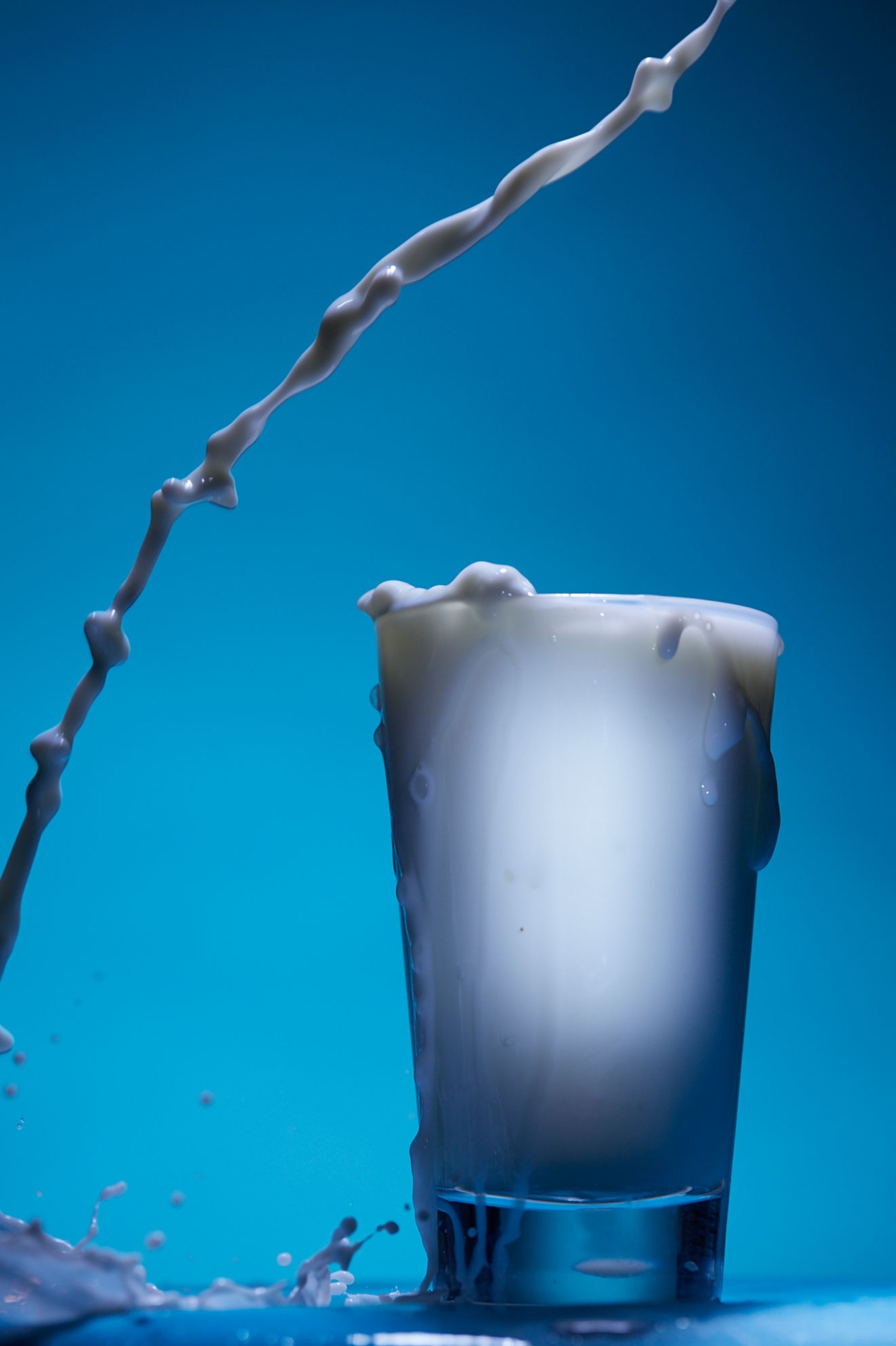 milk splashing into a cup