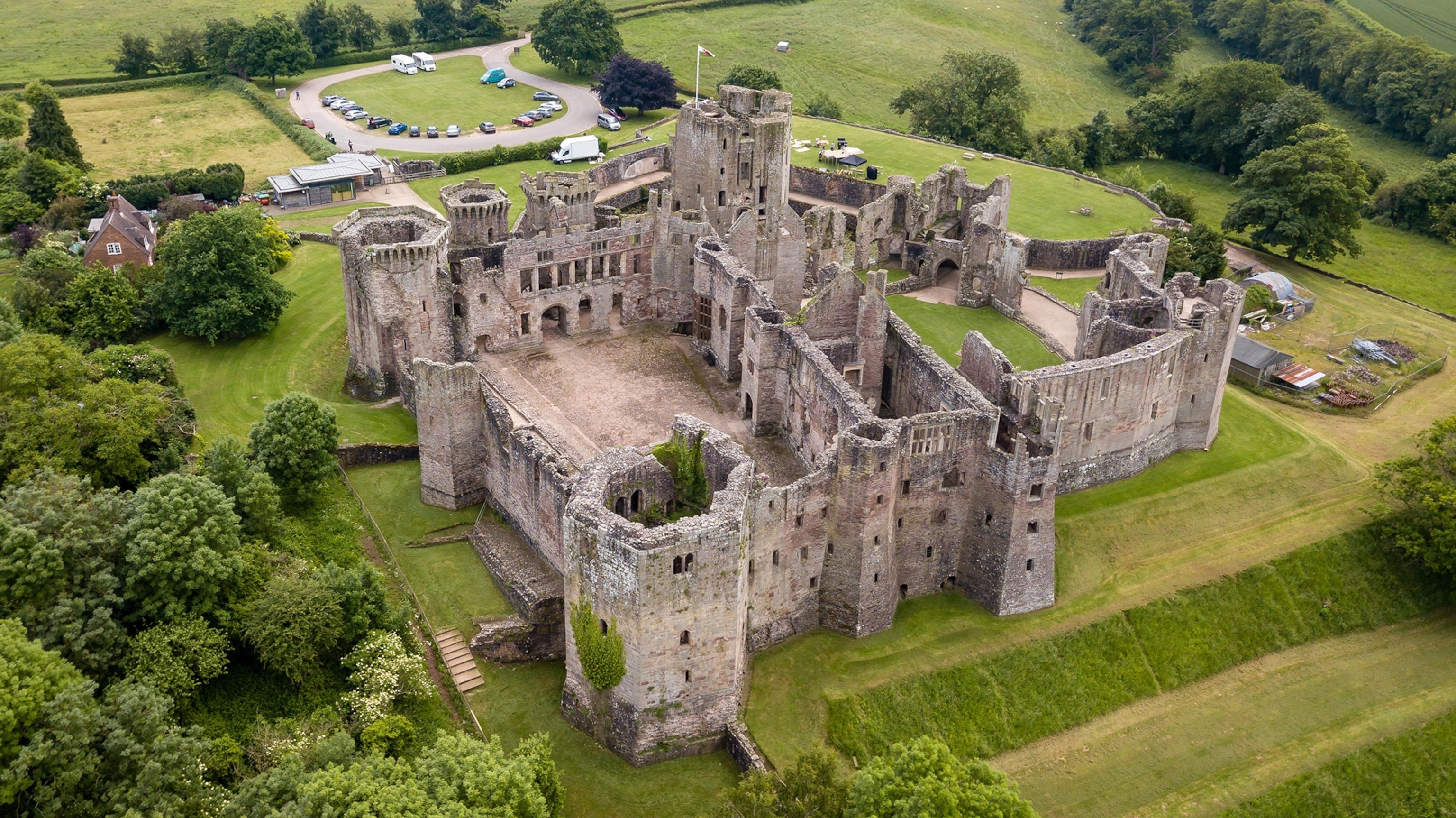 an Aerial view of Raglan Castle in Monmouthshire, South Wales, UK