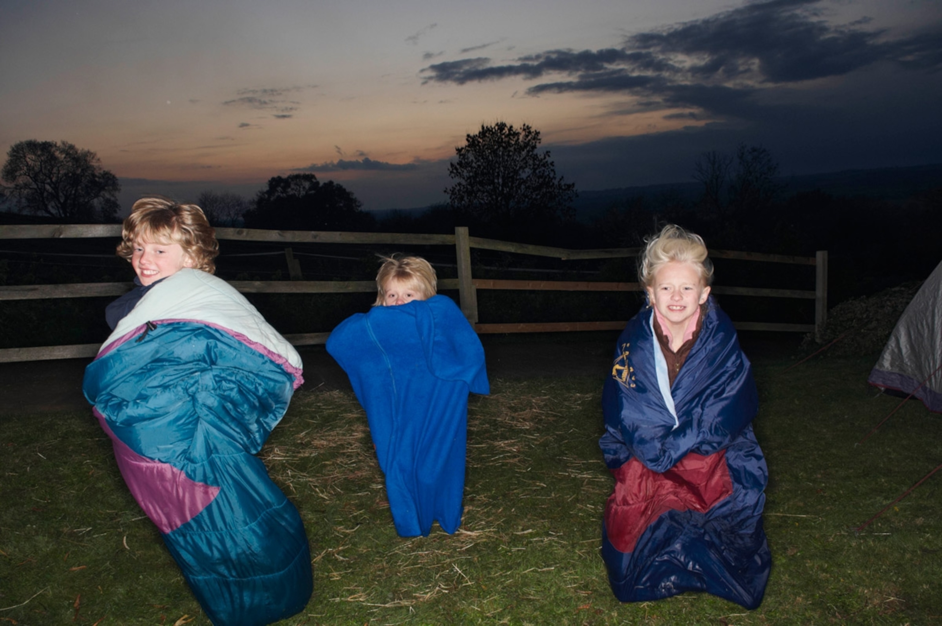 Sleeping bag races at dusk, Gretton, UK.