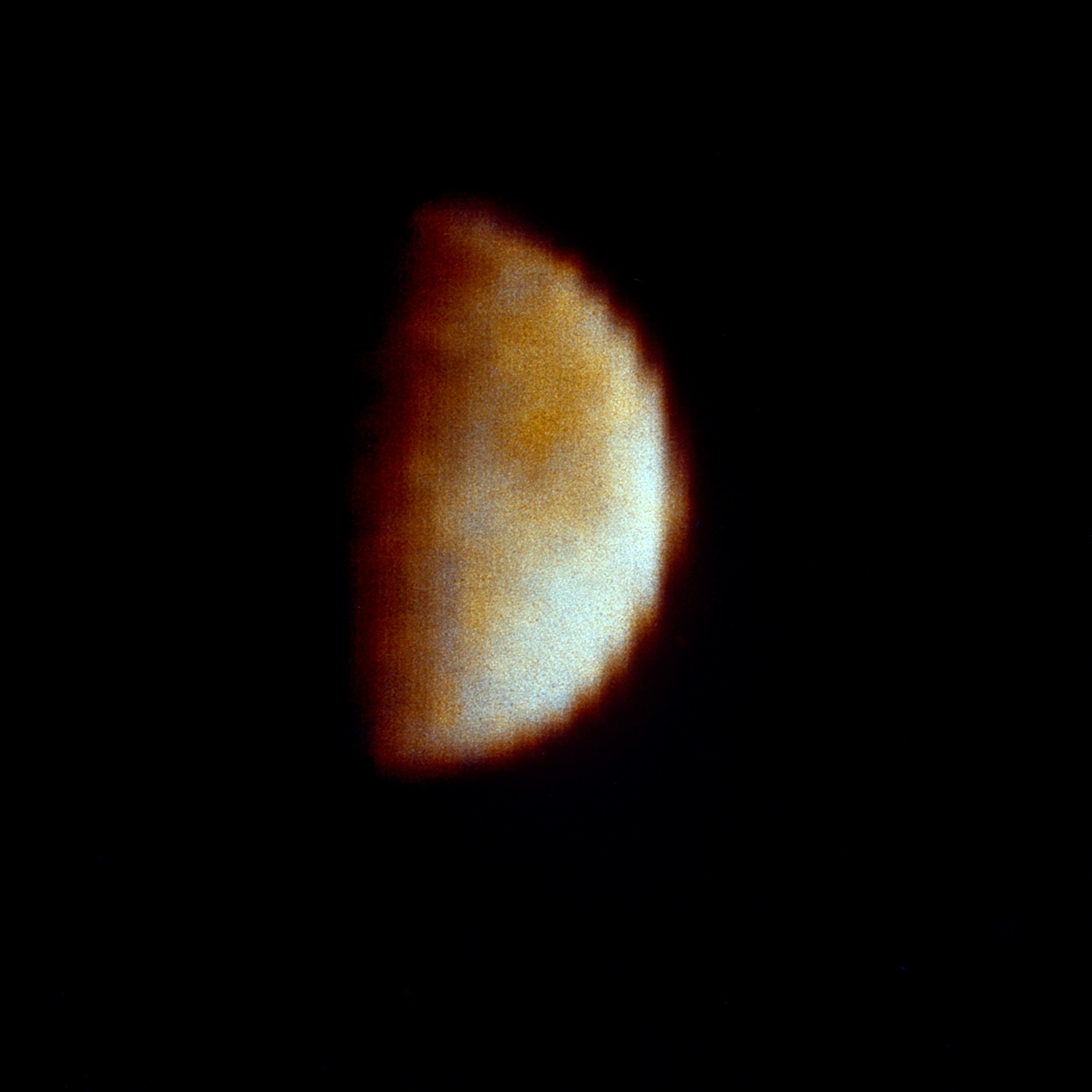 A blurry, low-resolution view of Eurpa at half-moon.