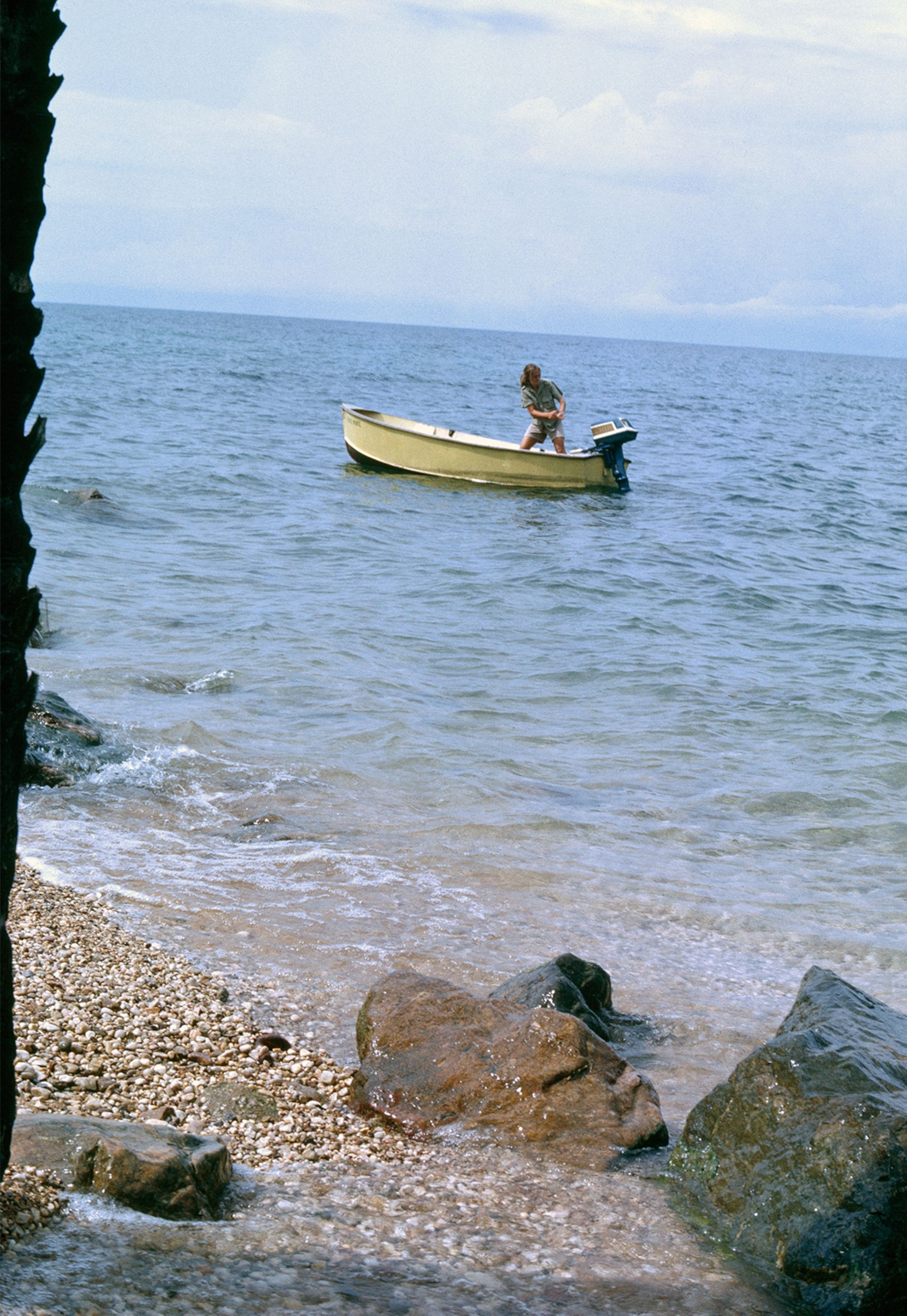 Jane Goodall starting a motor boat