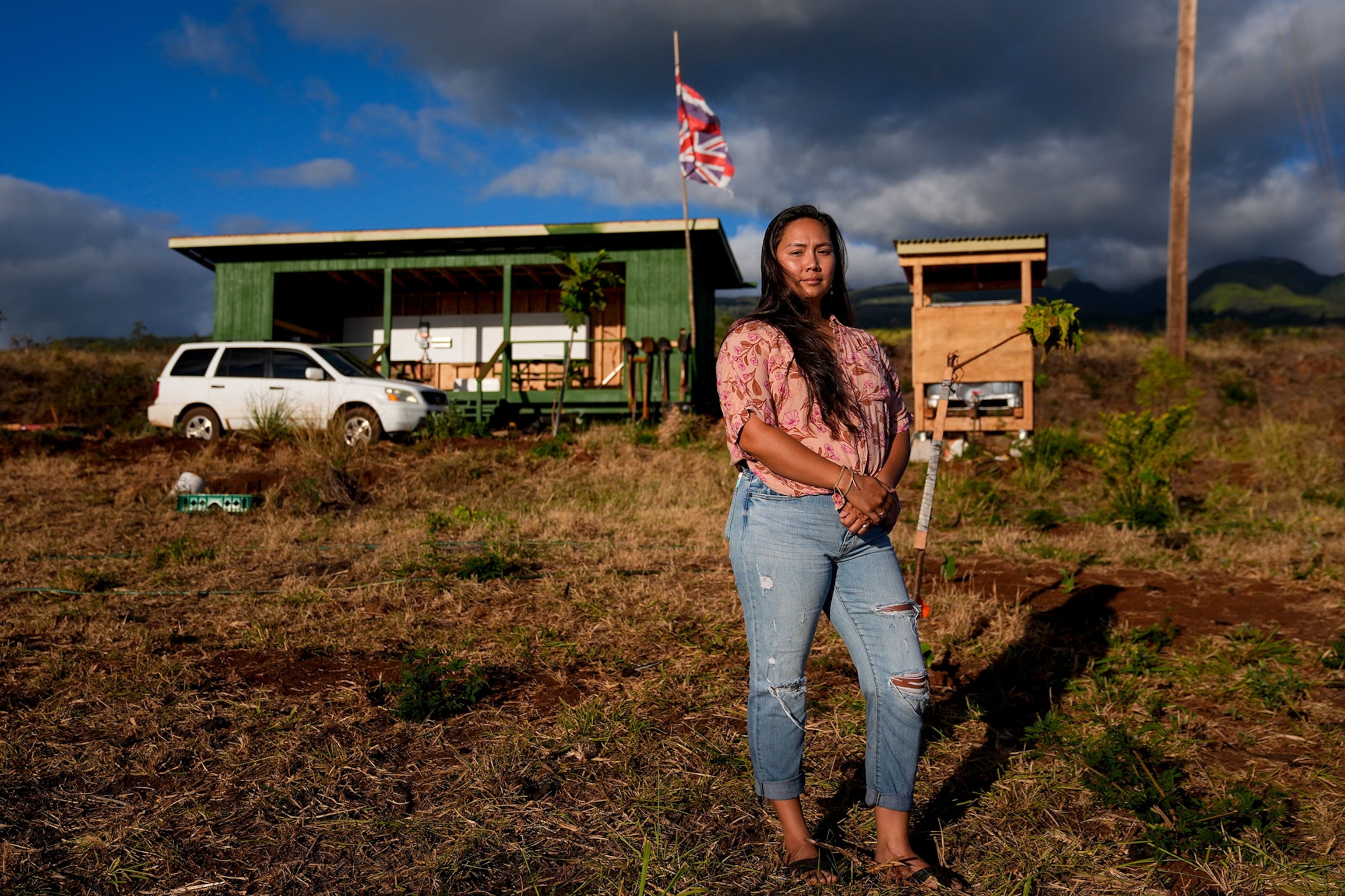Jordan Ruidas, a Lahaina Strong organizer, stands for a photo in an area of state land she is working to help re-green with Kaiaulu Initiatives