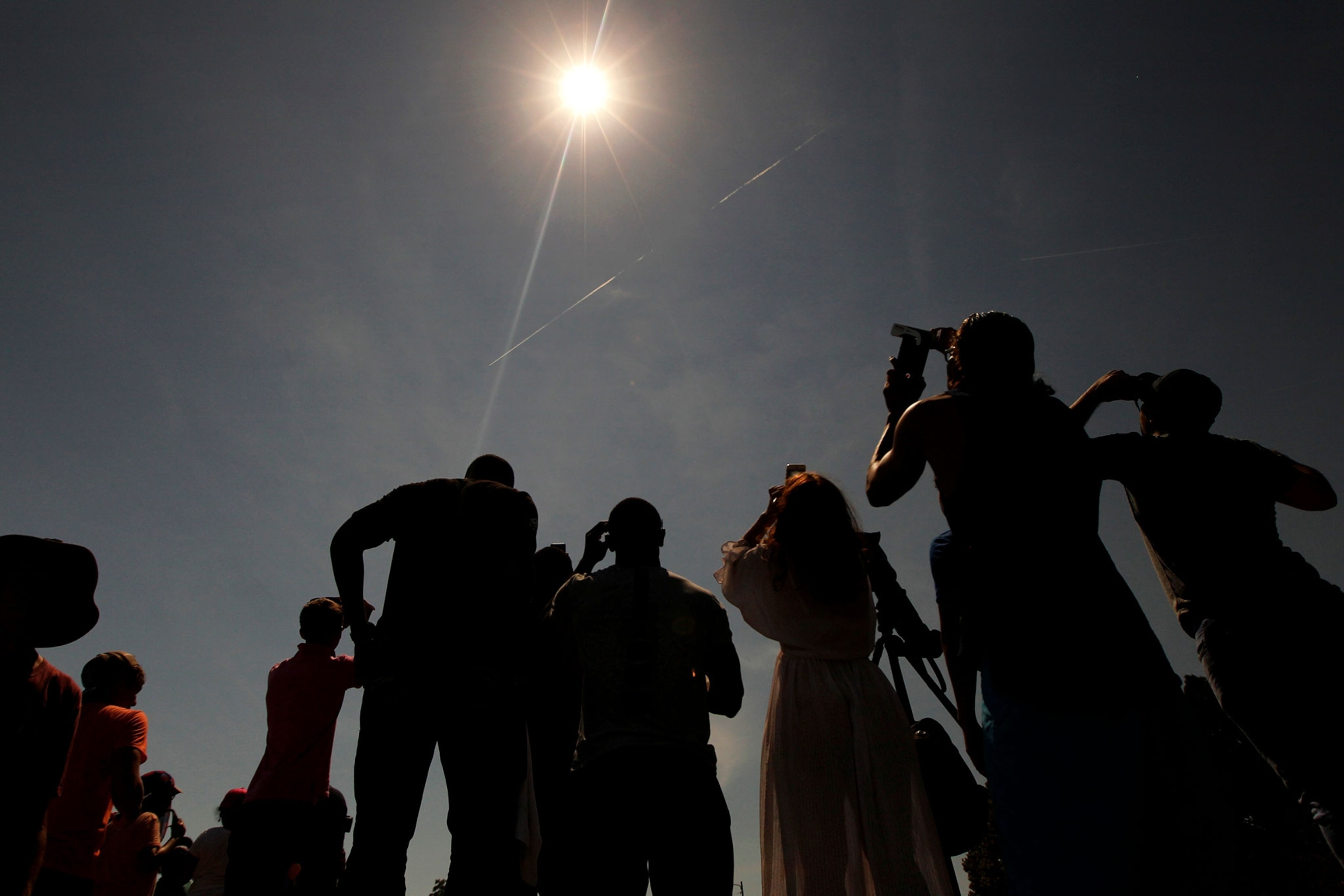 people watching the solar eclipse