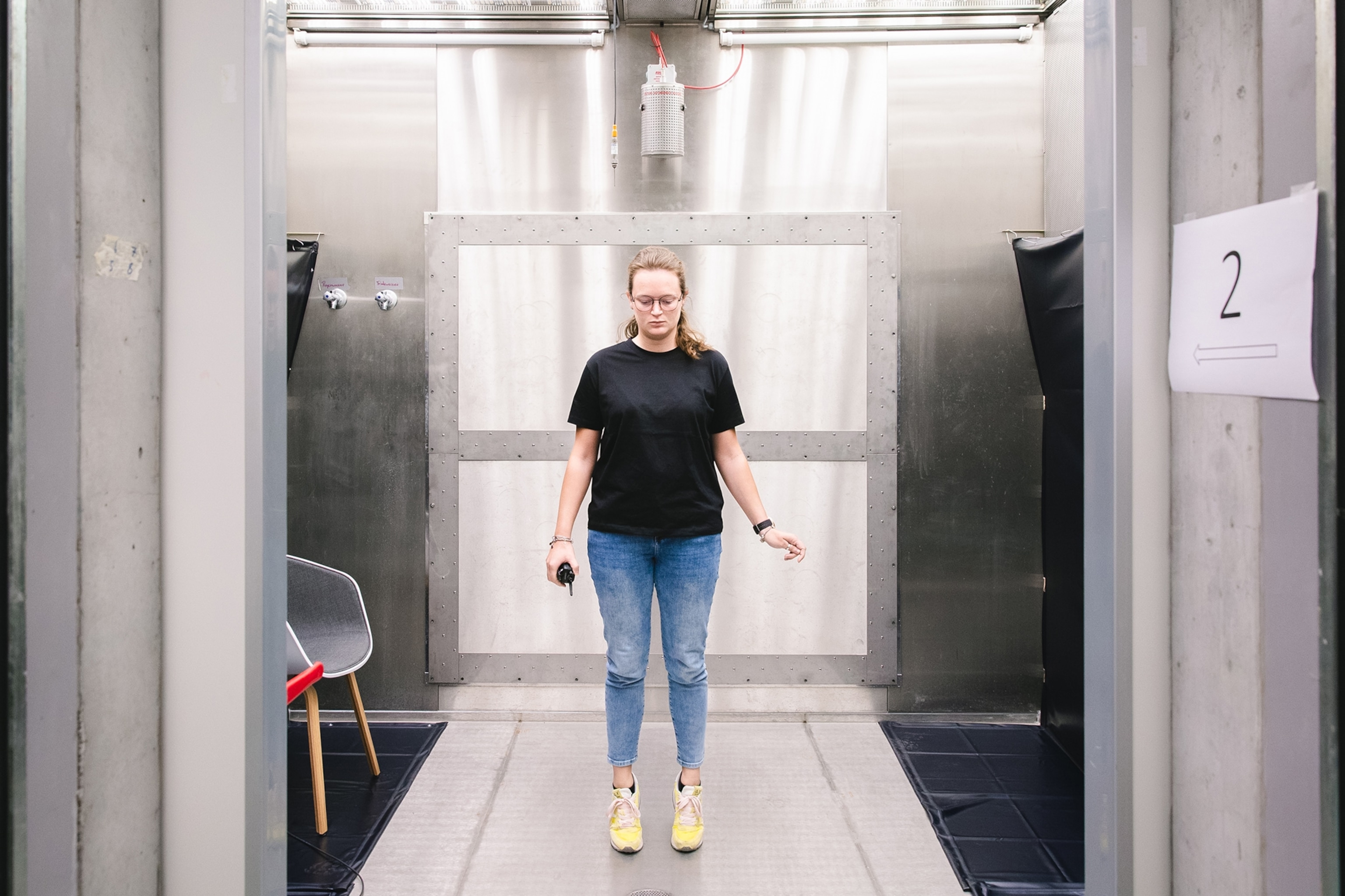 Nicole Fant stands in a thermal chamber during an experiment about thermal perception at terraXcube, Bolzano, Italy.