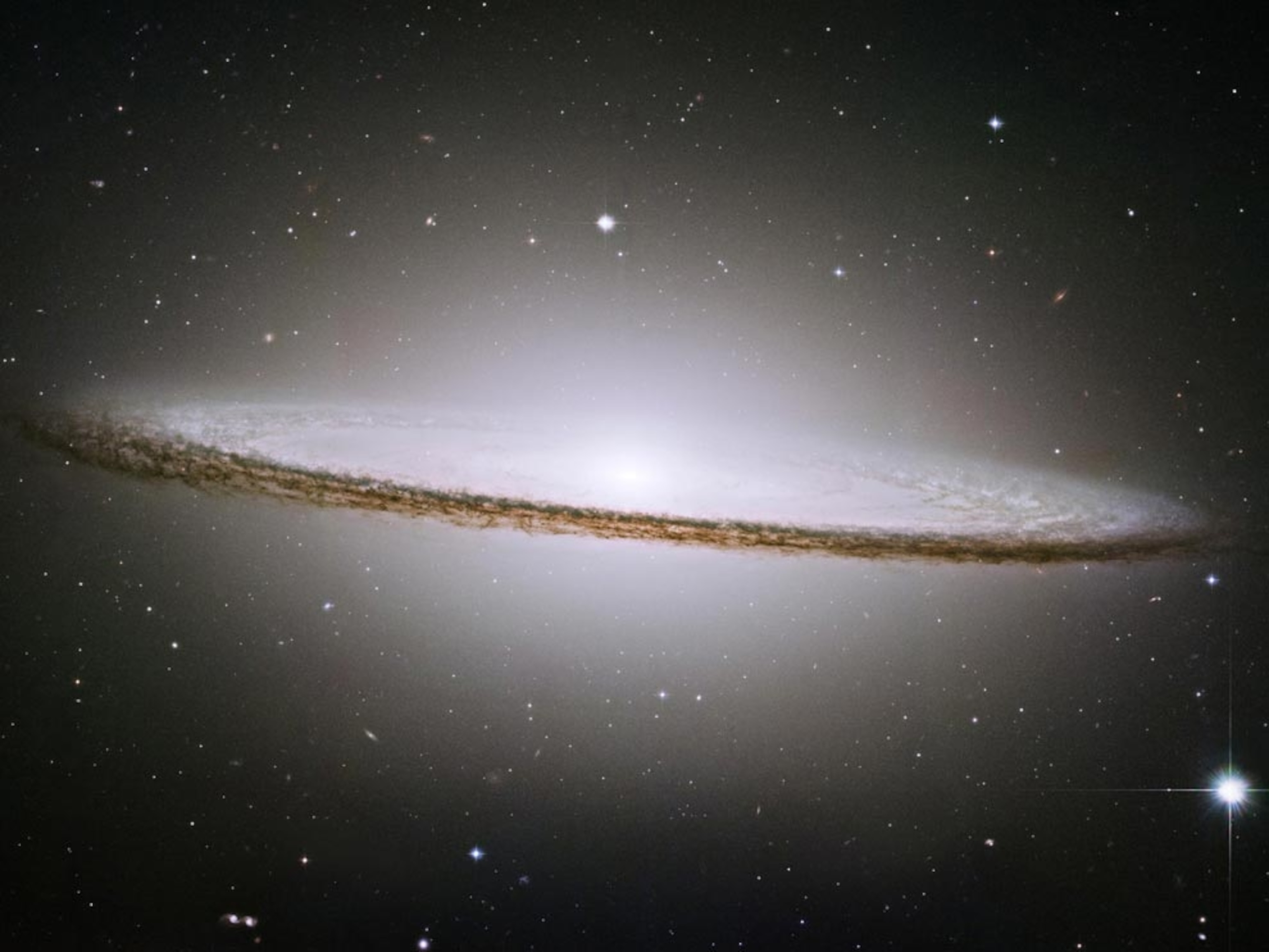 a glowing, sombrero-shaped galaxy