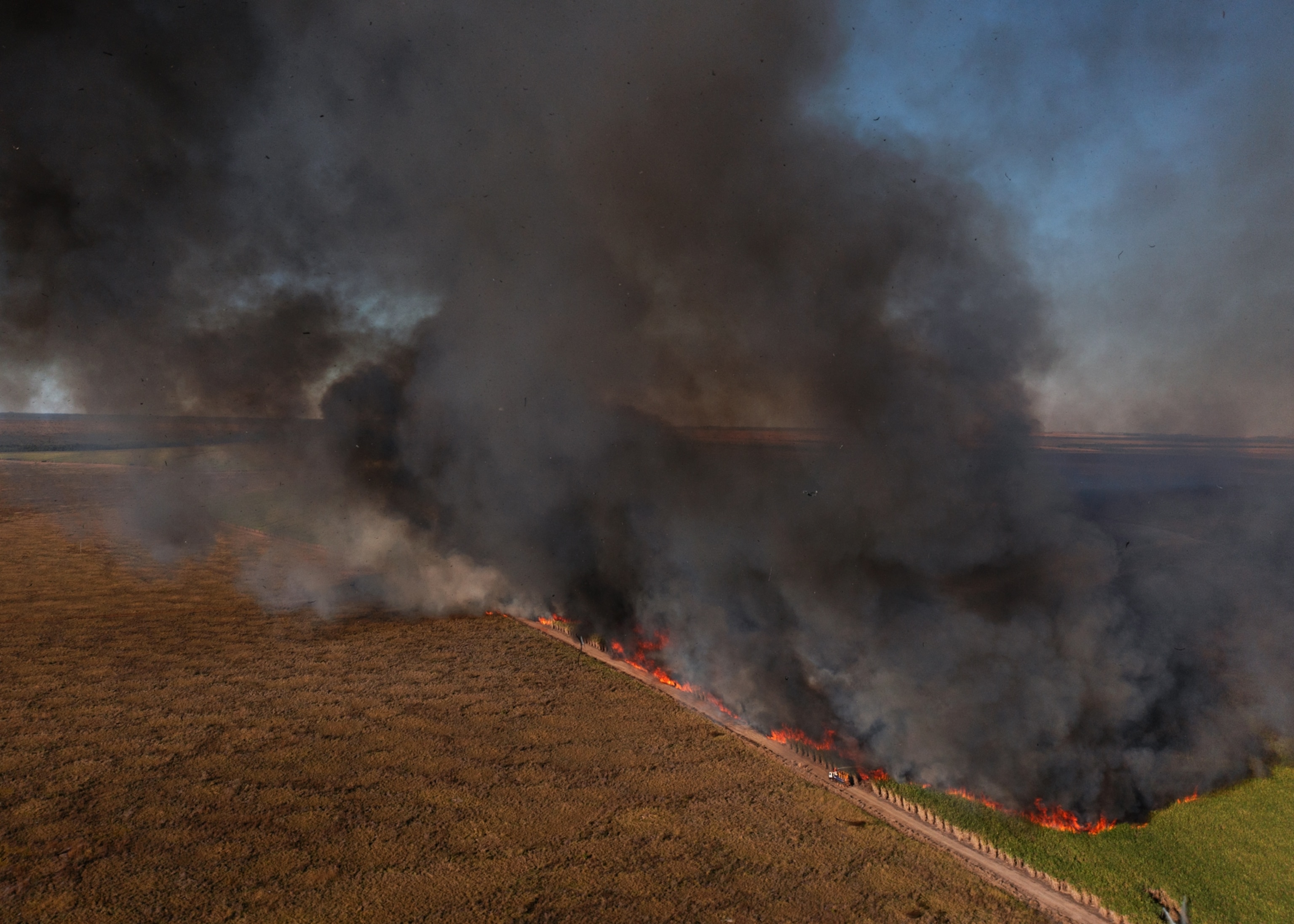 A wildfire that swept through a nearby sugarcane farm is still burning.