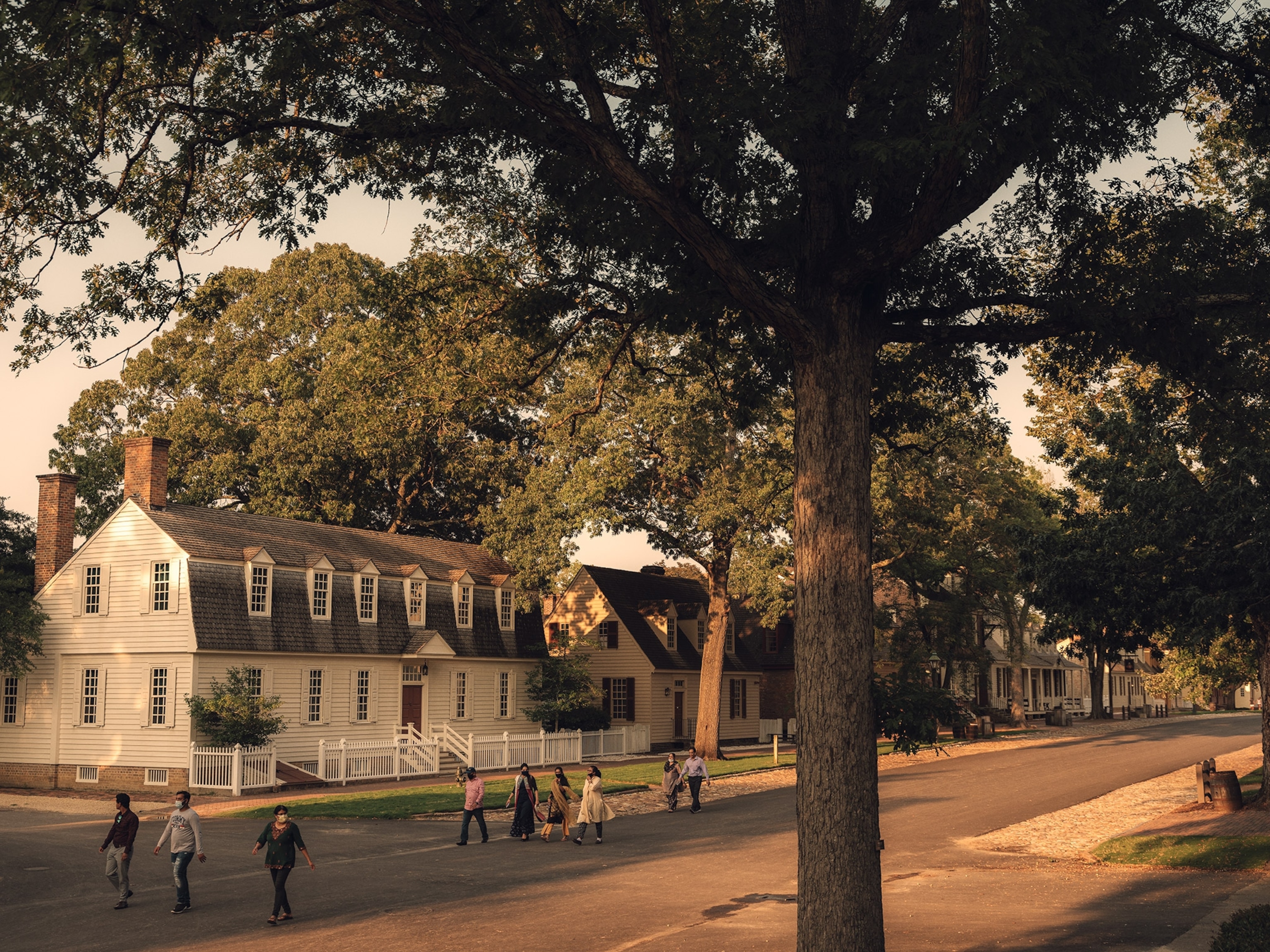 Visitors walk down the main street of colonial williamsburg