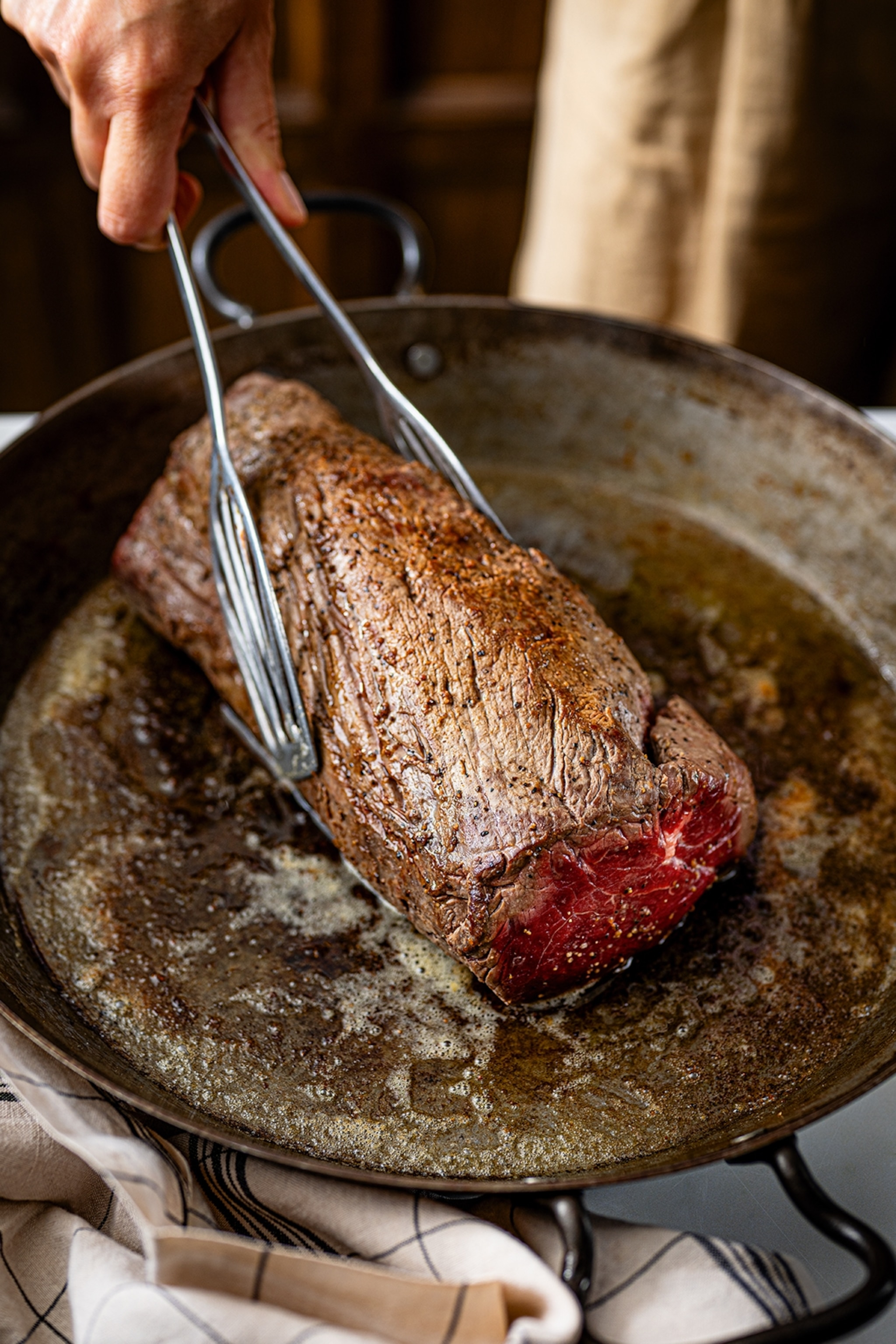 Searing pink beef in a pan