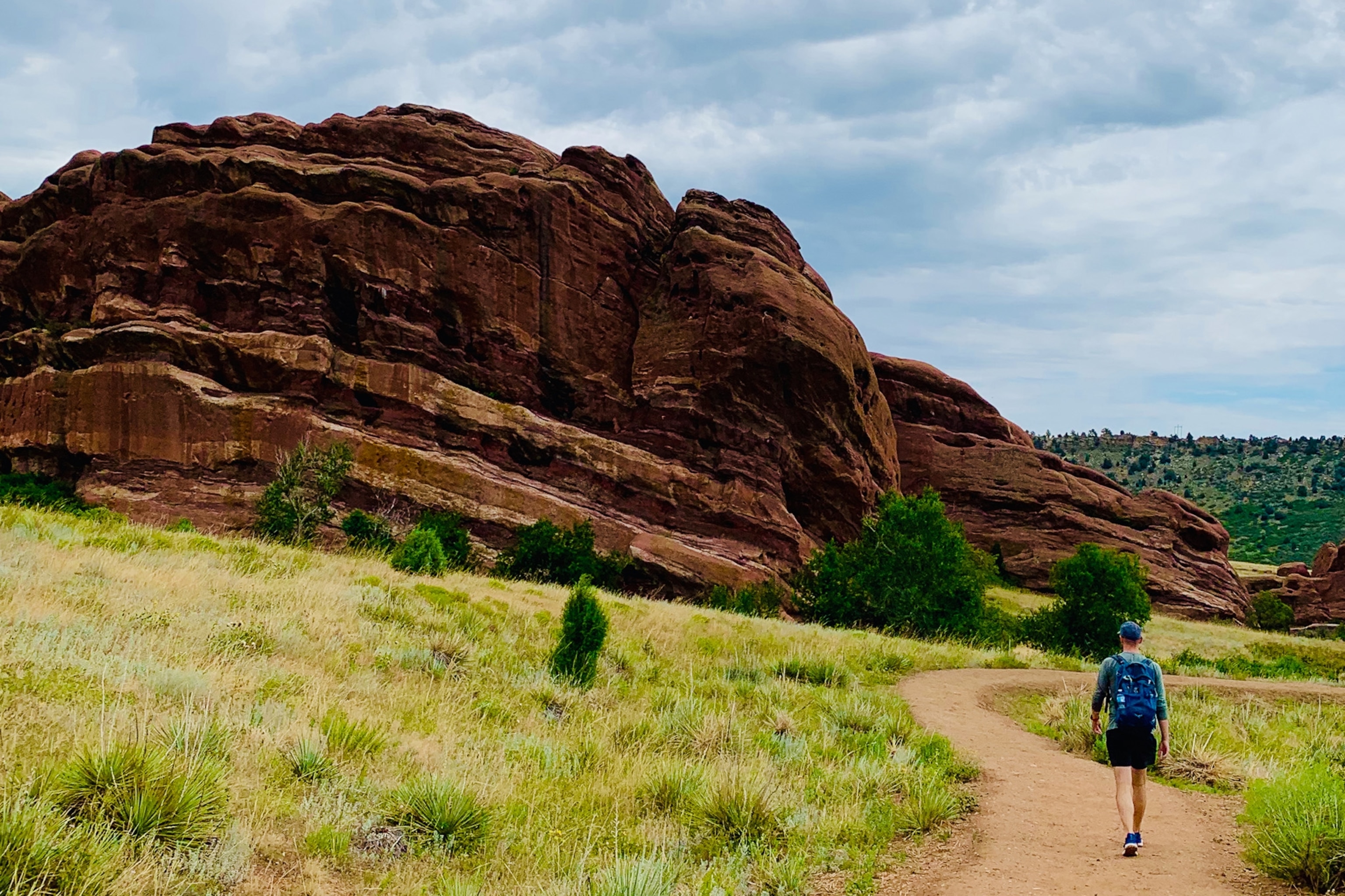 Hiker walks through Red Rocks Park
