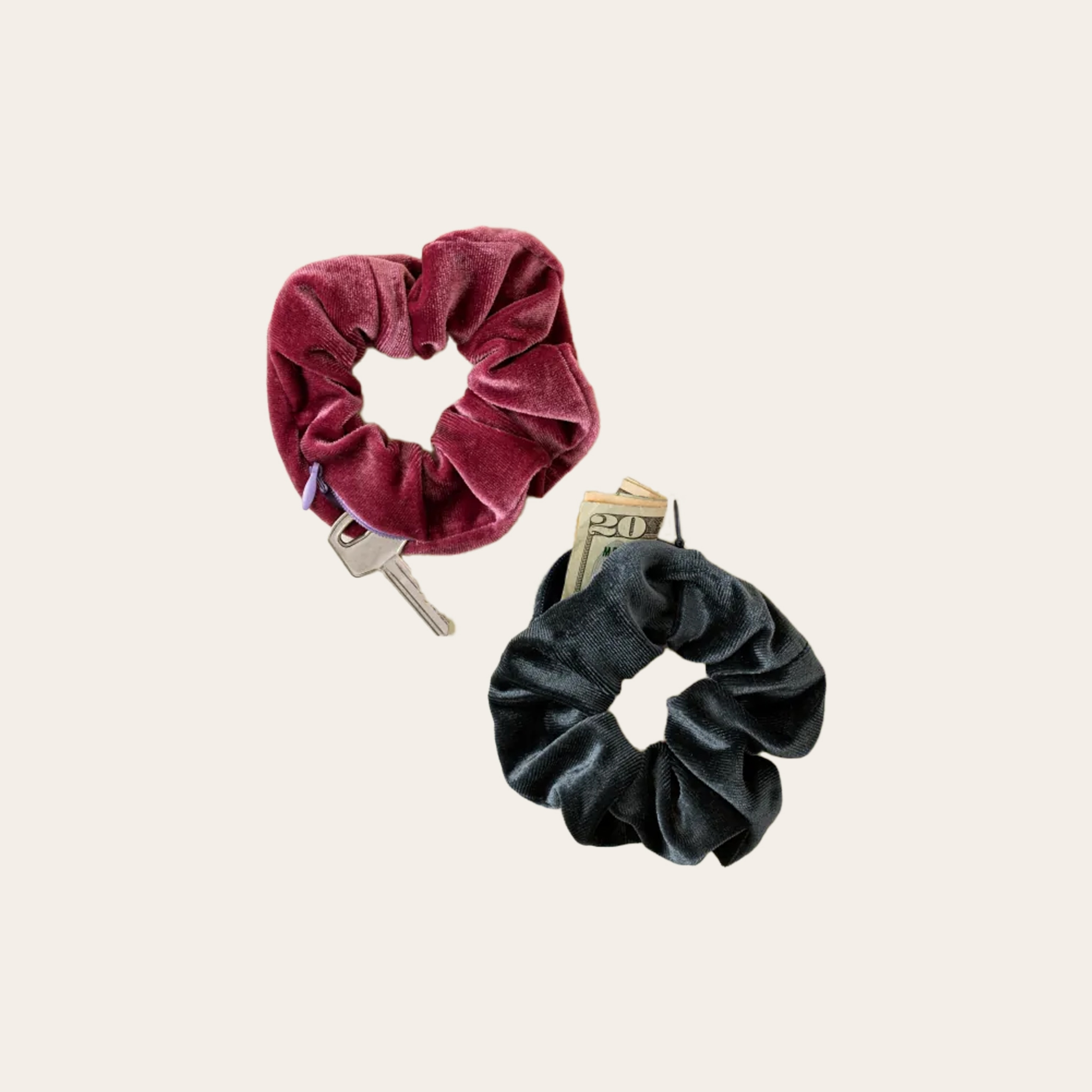 A set of two scrunchies, one red and one black with a pocket for keys.