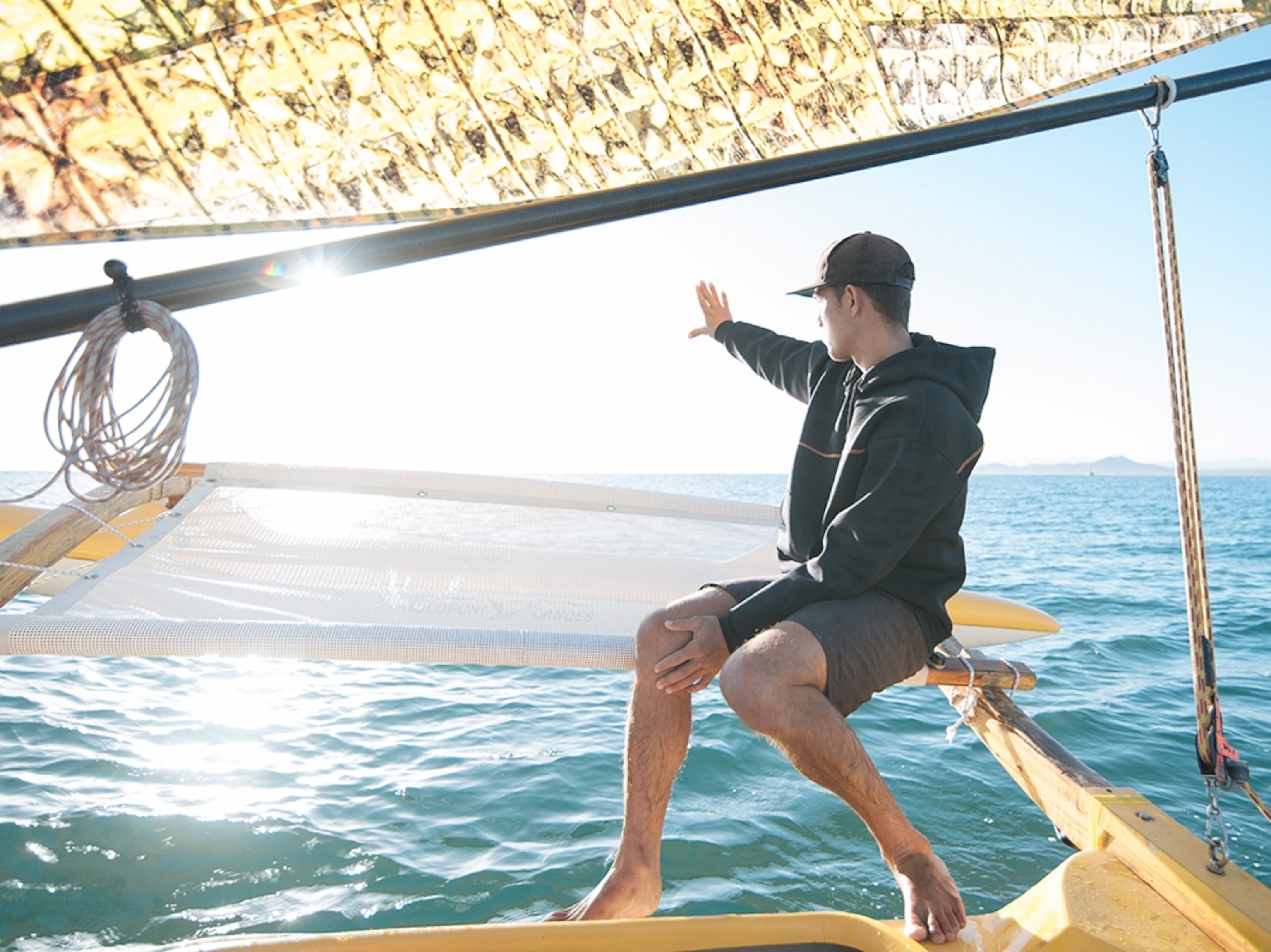 a man reading the sun on a Hawaiian sail canoe in Baja, Mexico