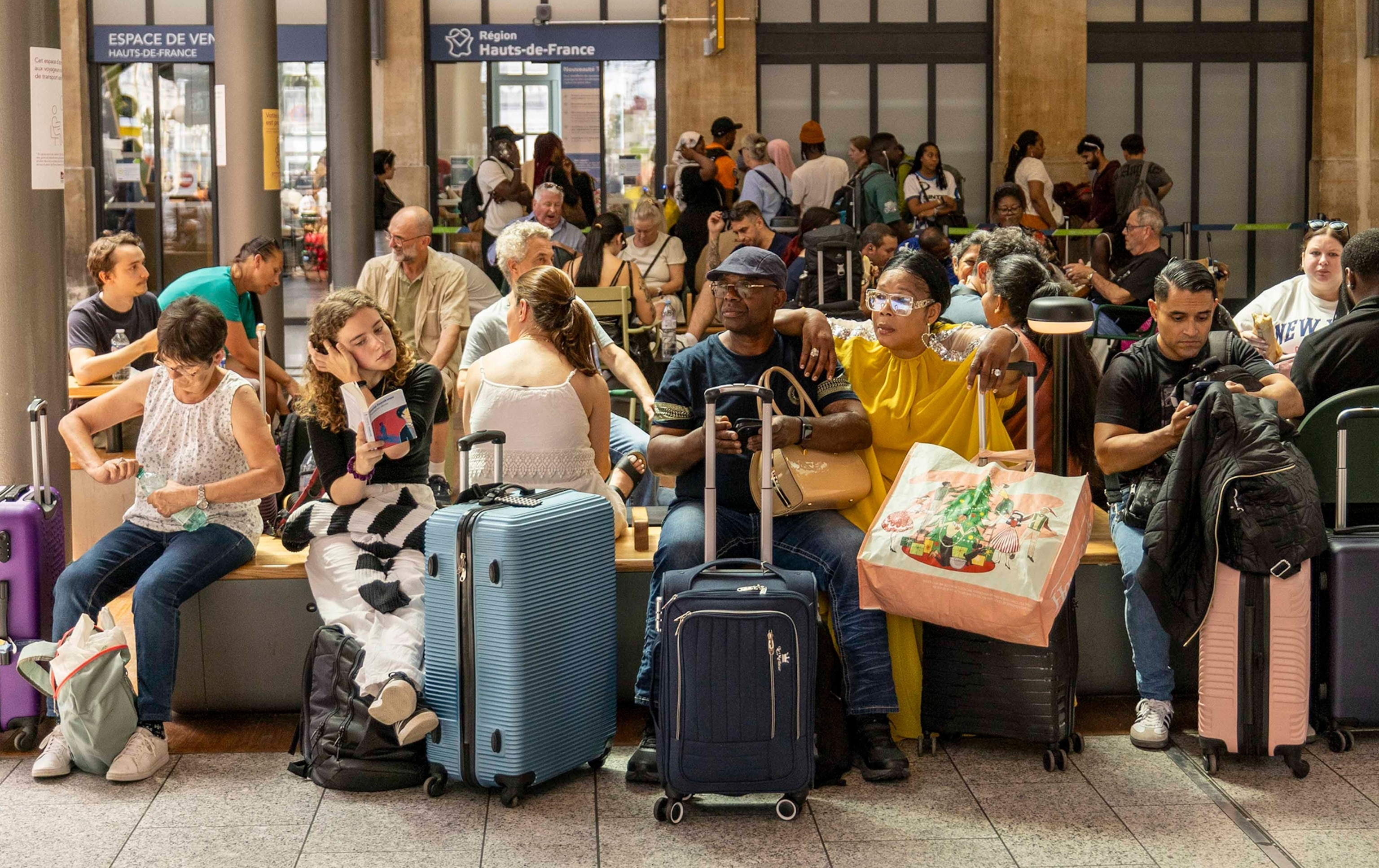 Visitors wait at Gare du Nord train station.