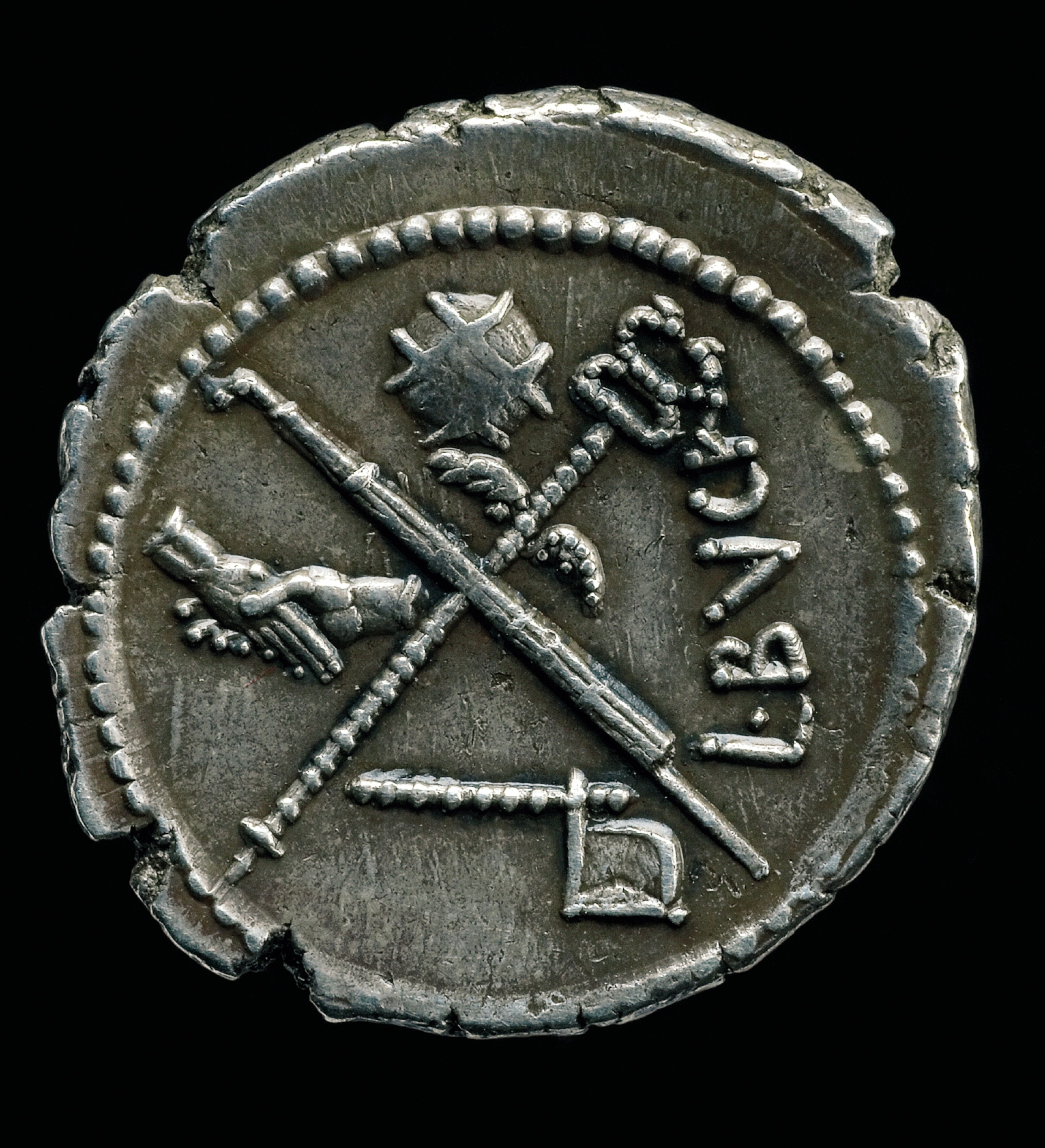 Minted just before the Ides of March in 44 B.C., a coin shows two joined hands—a sign of trust between Caesar and his army—and a globe, a symbol of Rome’s worldly dominion.