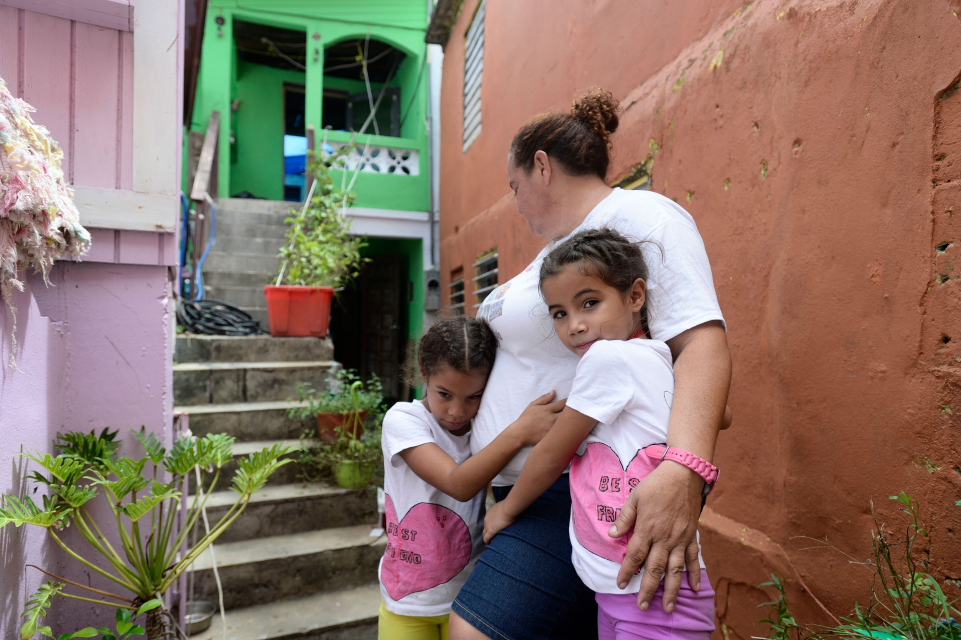 La Perla resident Maritza Rosado with her granddaughters.