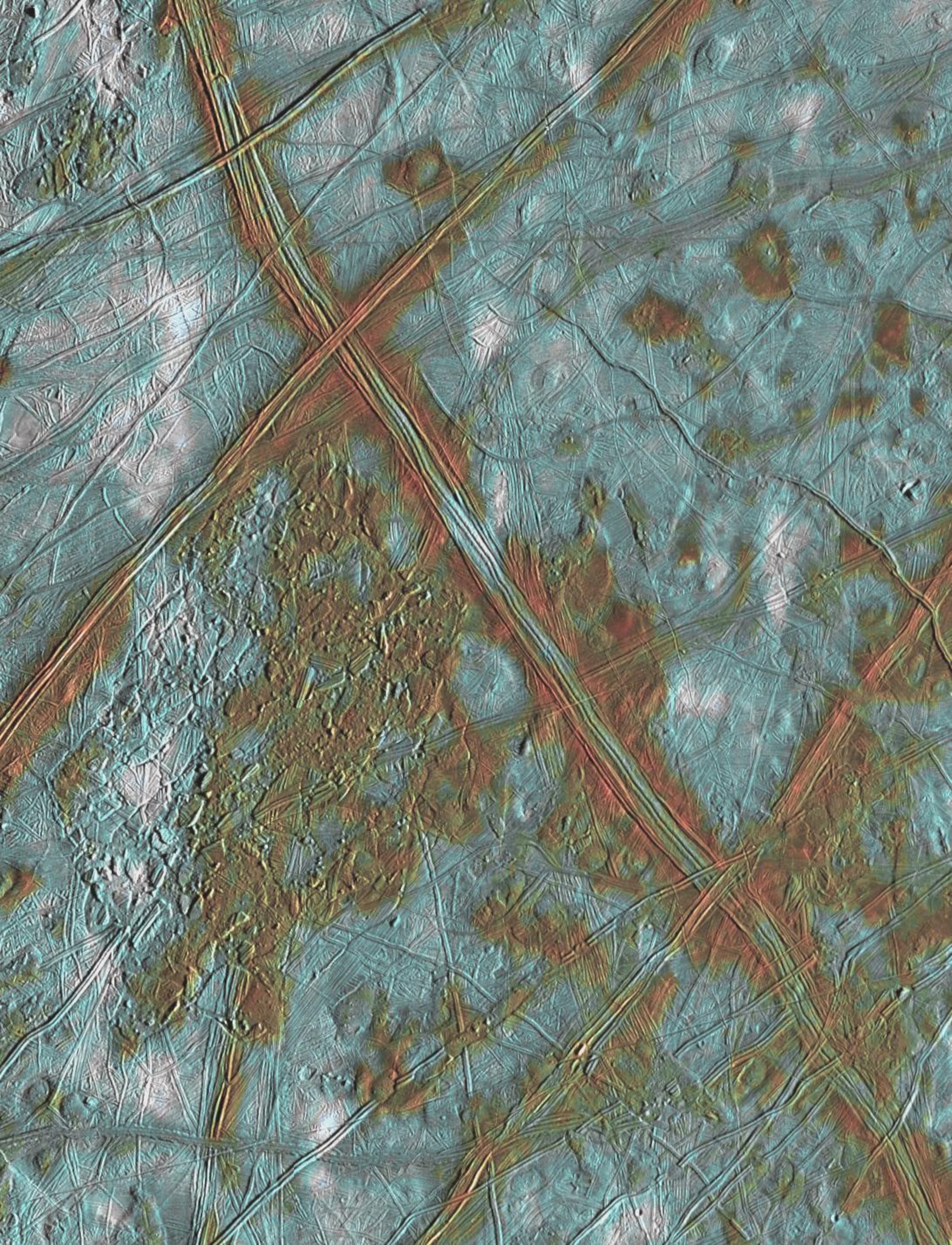 A detailed view of Europa's surface, which appears blue and icy, with streaks of brown domes and ridges.