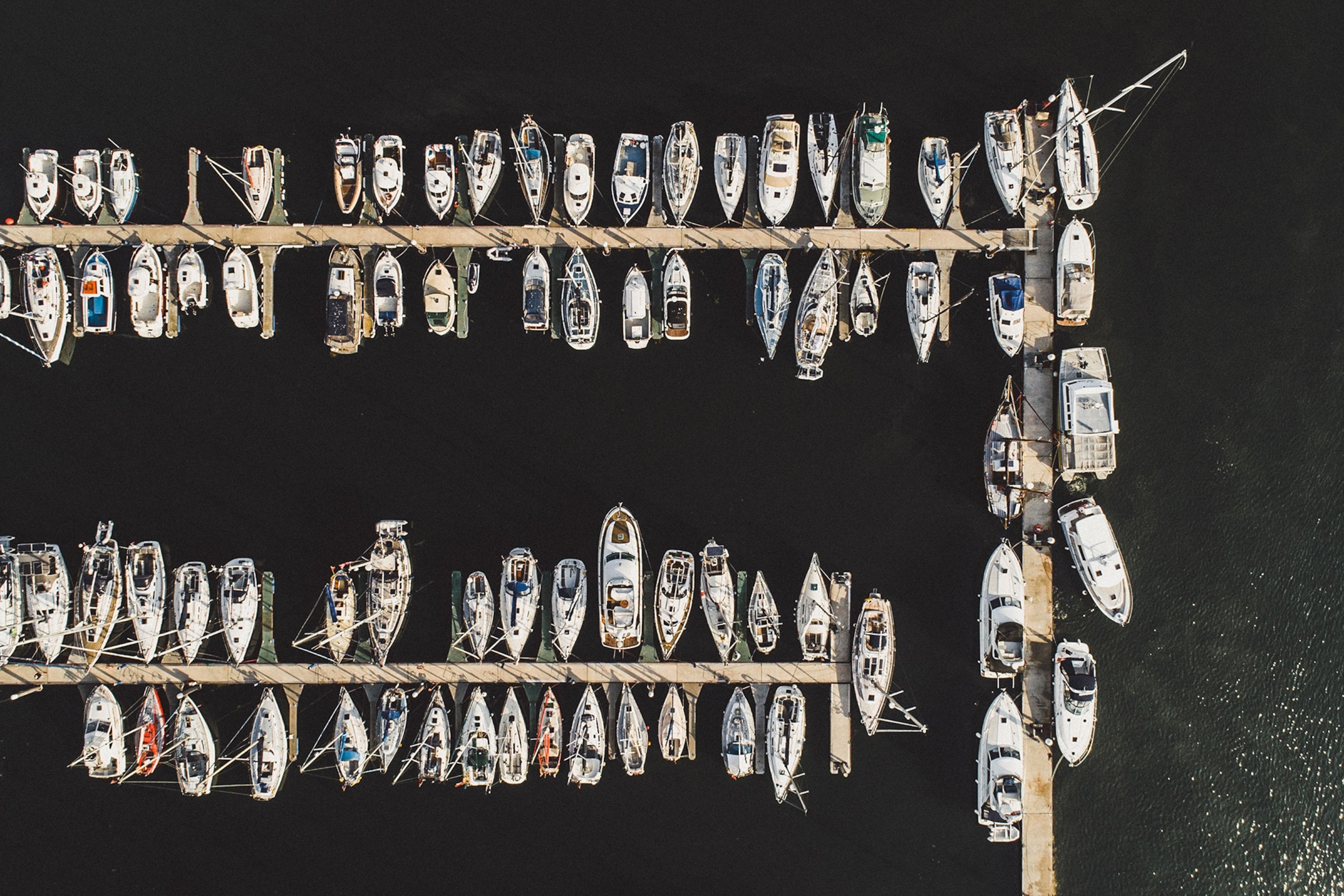 A birds-eye view of boats in a harbour.