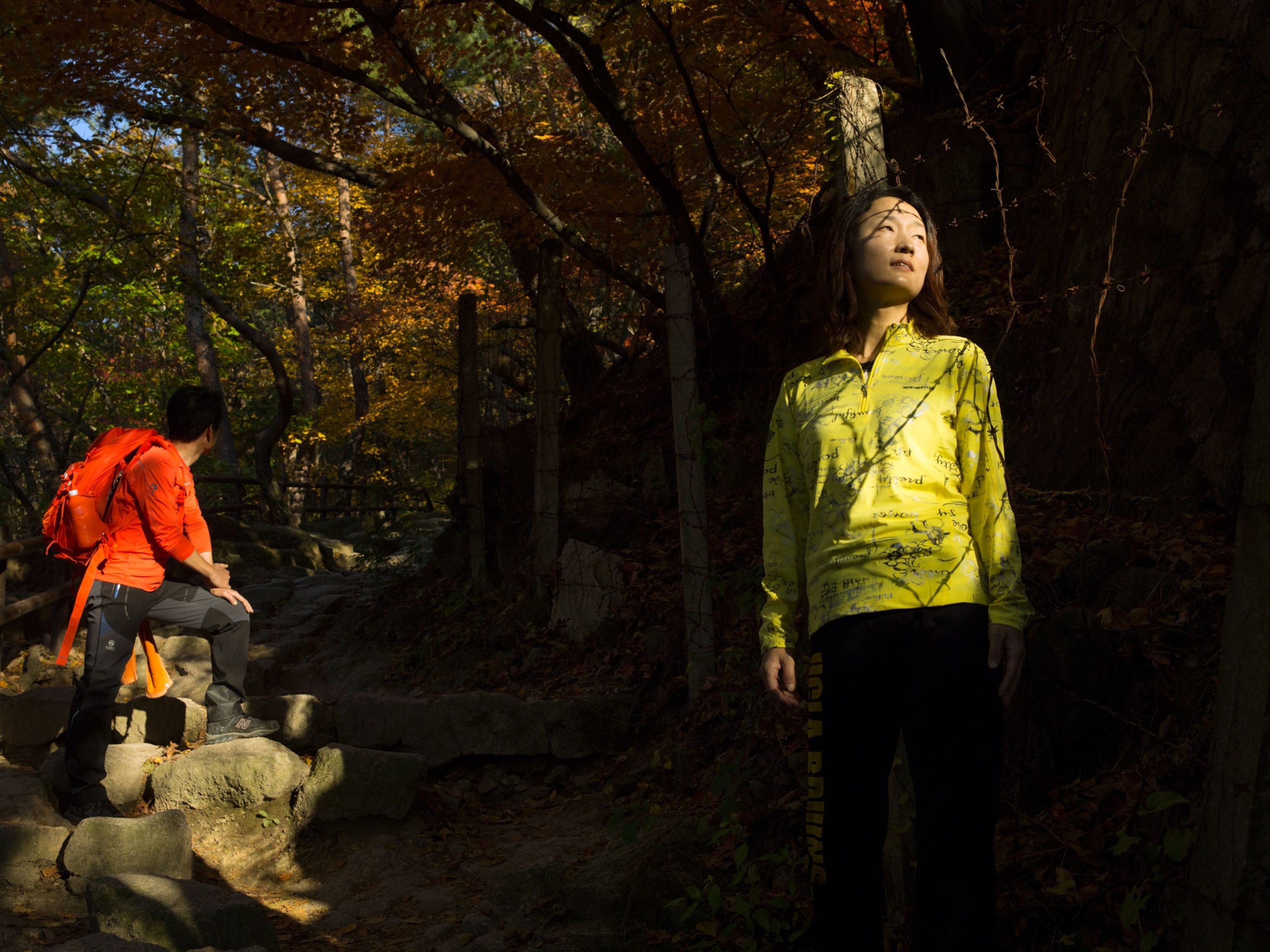 Hikers take a break in the woods.
