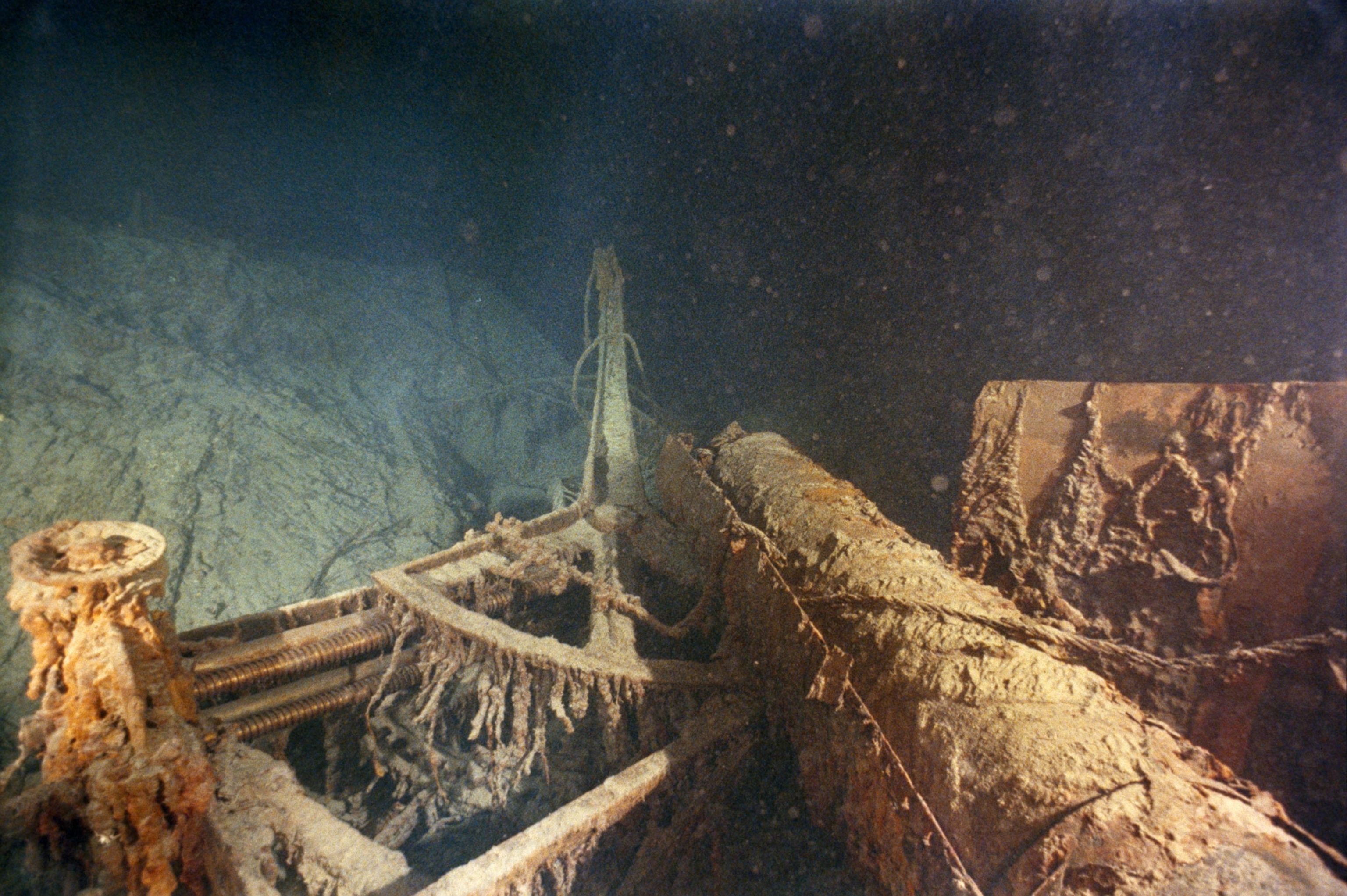 Piece of the deck of the Titanic fallen over and covered in elements from the ocean.