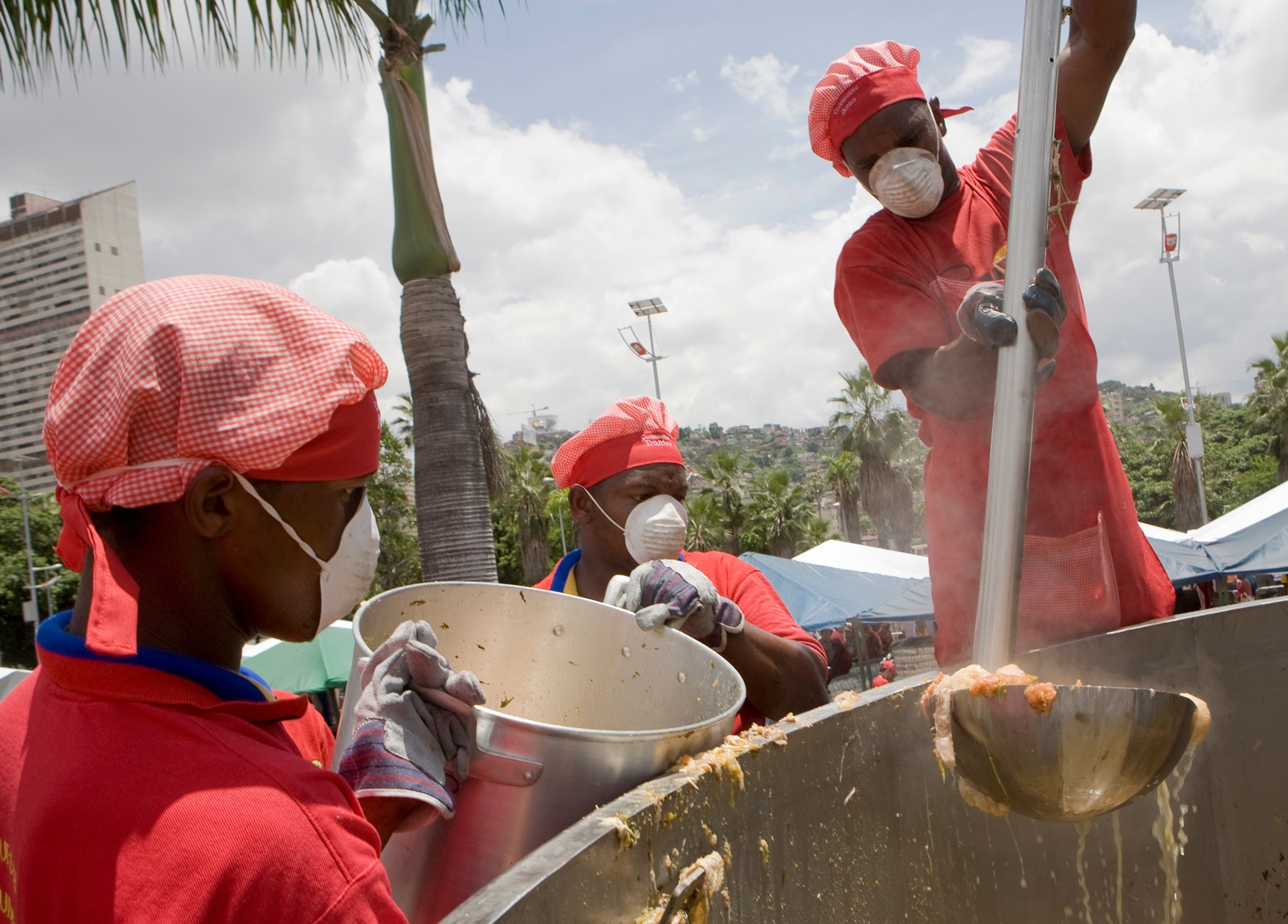 Cooks make a huge 'sancocho' - a traditional stew of beef, chicken, vegetables and potatoes - in a 15,000 liter pot in Caracas September 15, 2007. The organisers hope the soup will break the Guinness world record formerly held by Mexico with with a 5,045-liter pot of chili-beef soup. (VENEZUELA)