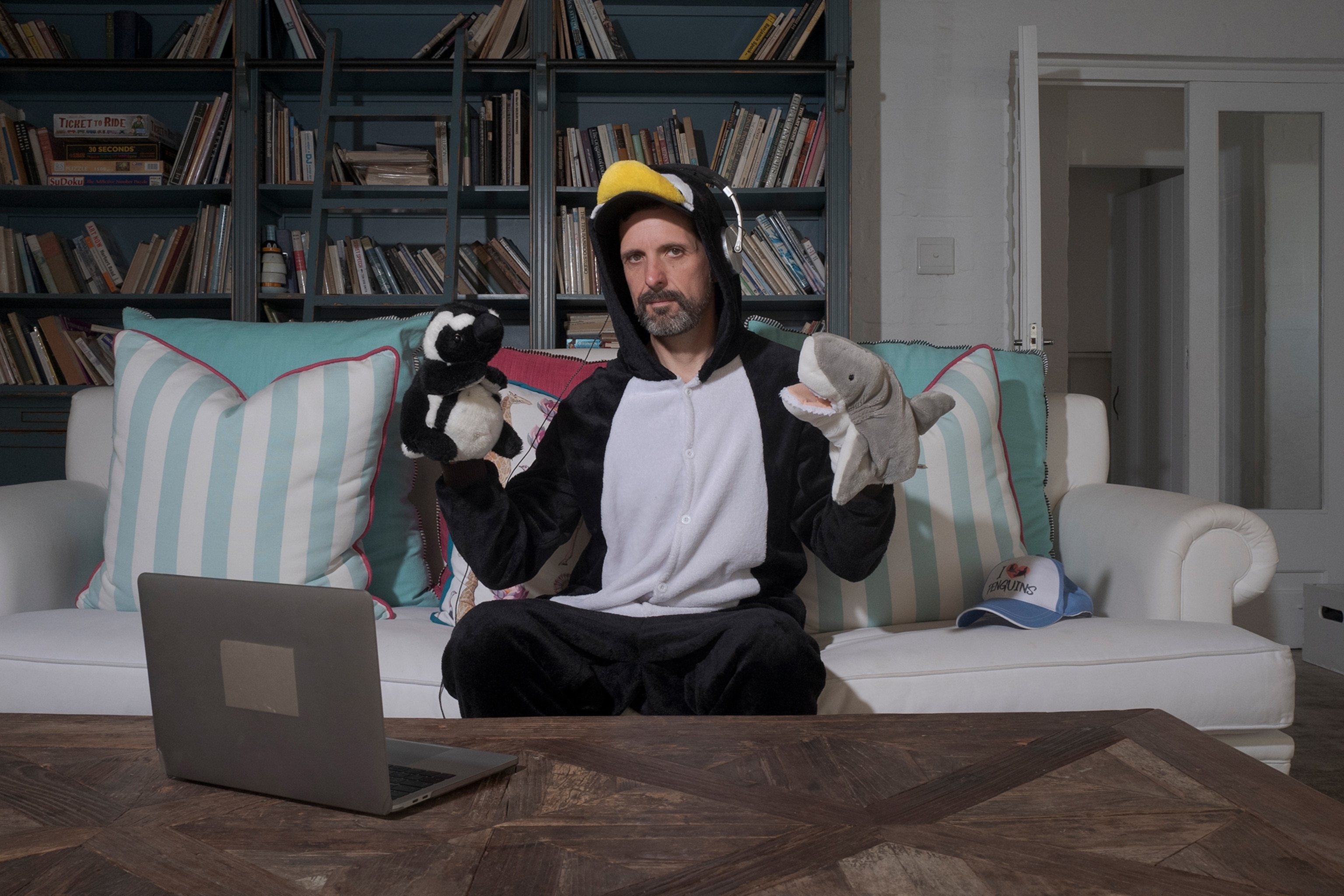 Picture of Jon Monsoon dressed as a penguin for a virtual educational experience about the dangers penguins are facing