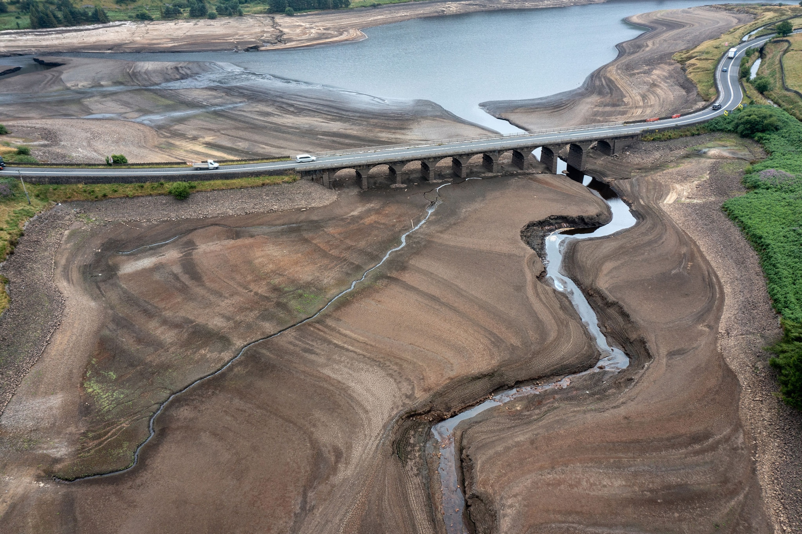 In this aerial view the bed of the Woodhead reservoir can be seen as Summer water levels become reduced