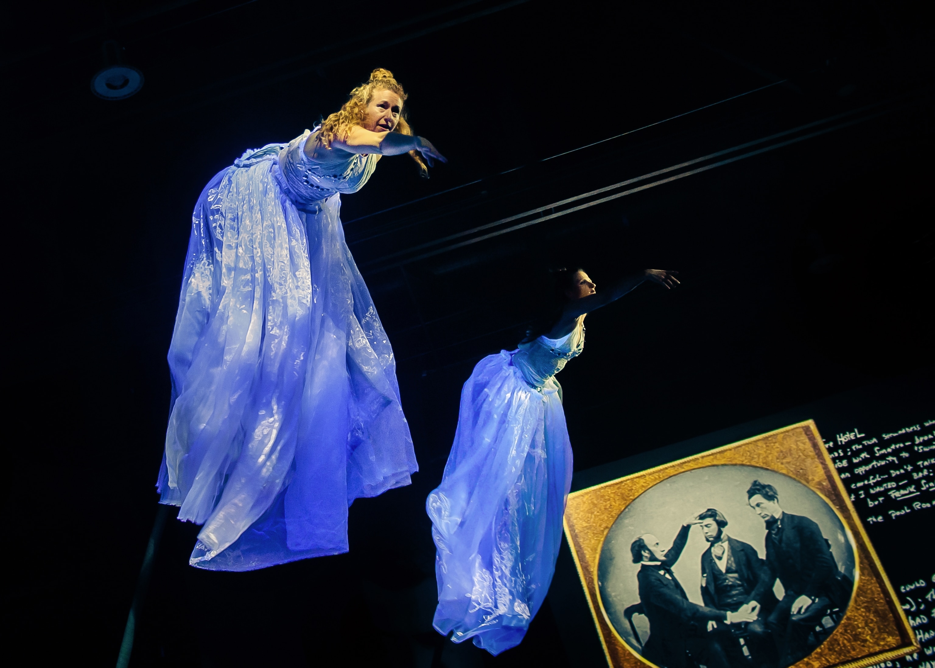 A woman appears to levitate at a magic show