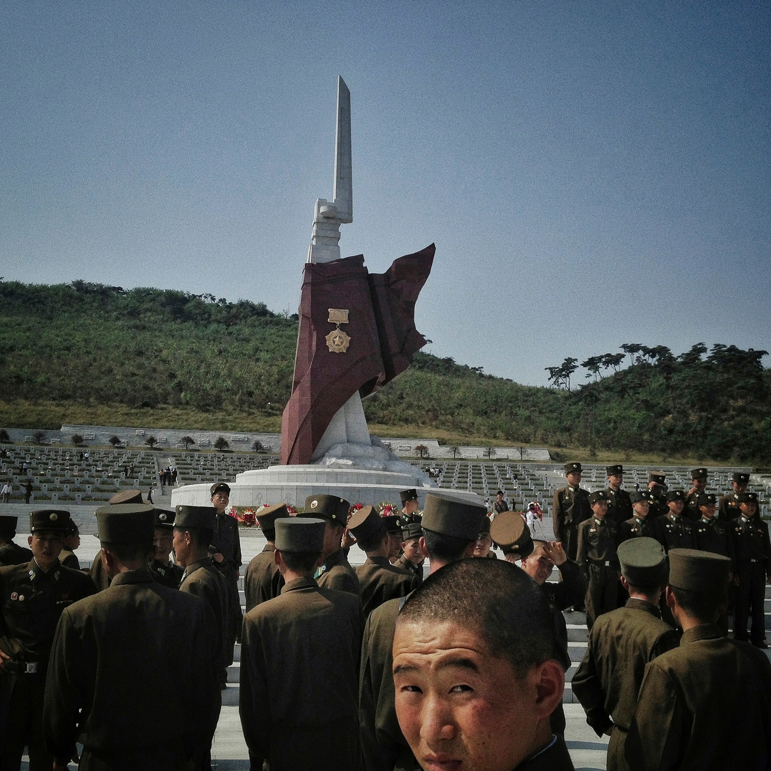 soldier by a monument