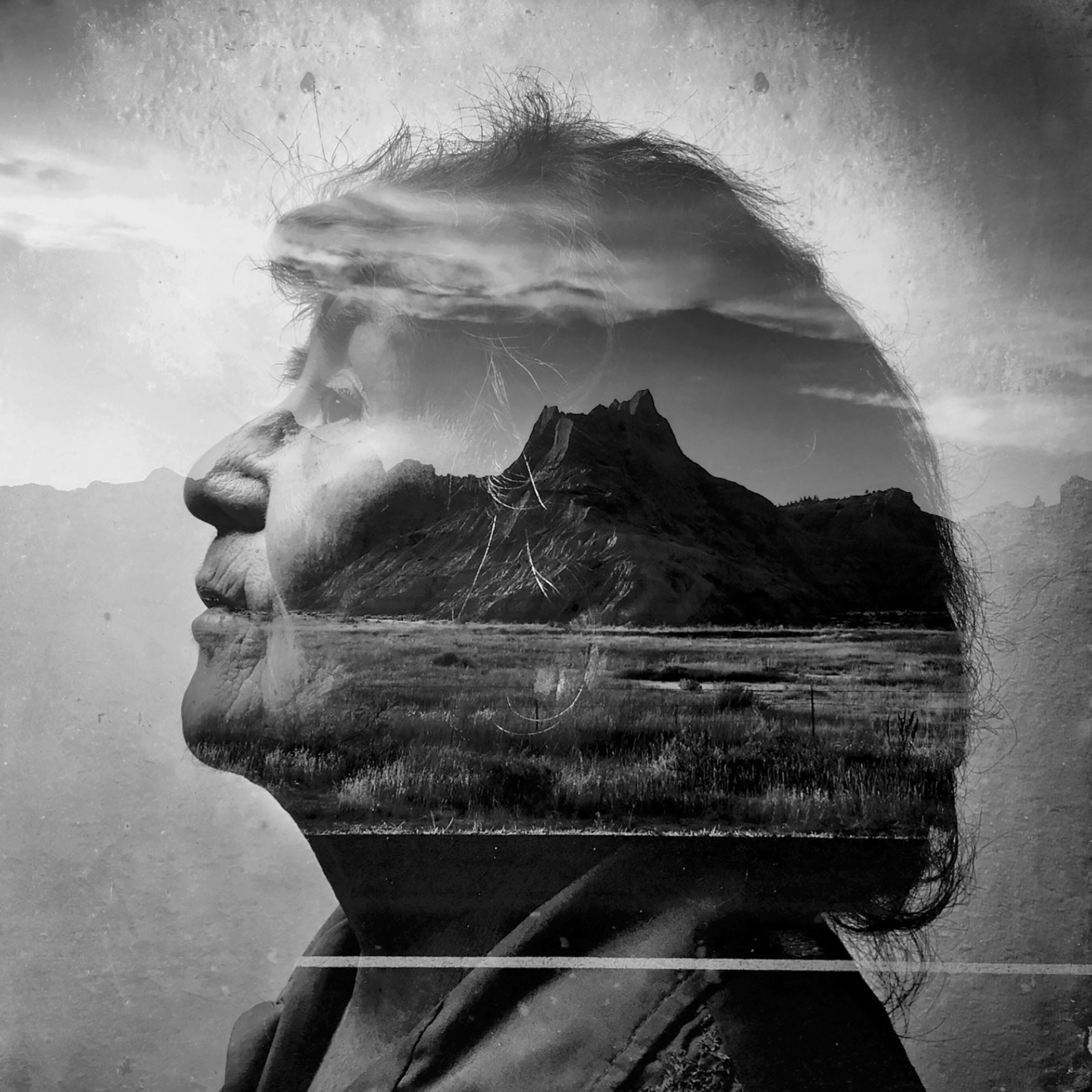 Picture of b&w photo of woman's profile portrait on nature background.