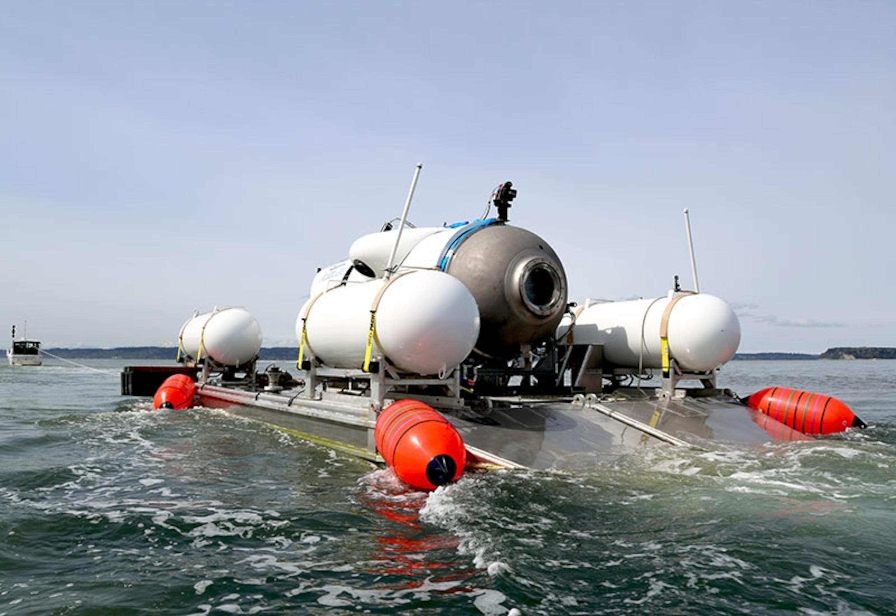 A person stands on top of a submersible before it has descended.