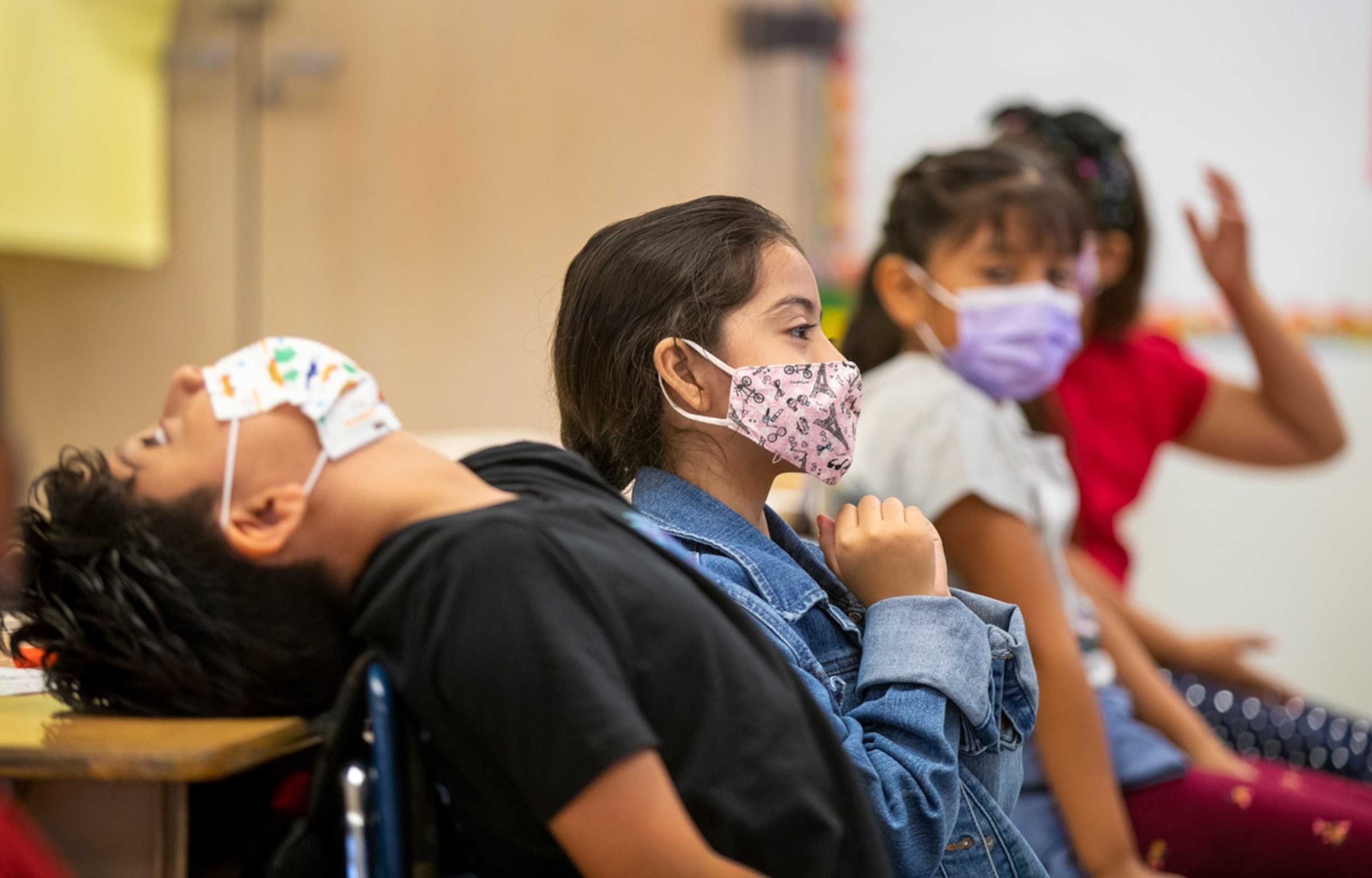 Third grade dual language students wear masks and prepare to take a photo with Los Angeles Unified Interim Superintendent Megan K. Reilly, teachers, principals, school site employees, on the first day of school at Los Angeles Unified School District at Montara Avenue Elementary School on Monday, Aug. 16, 2021 in Los Angeles, CA.