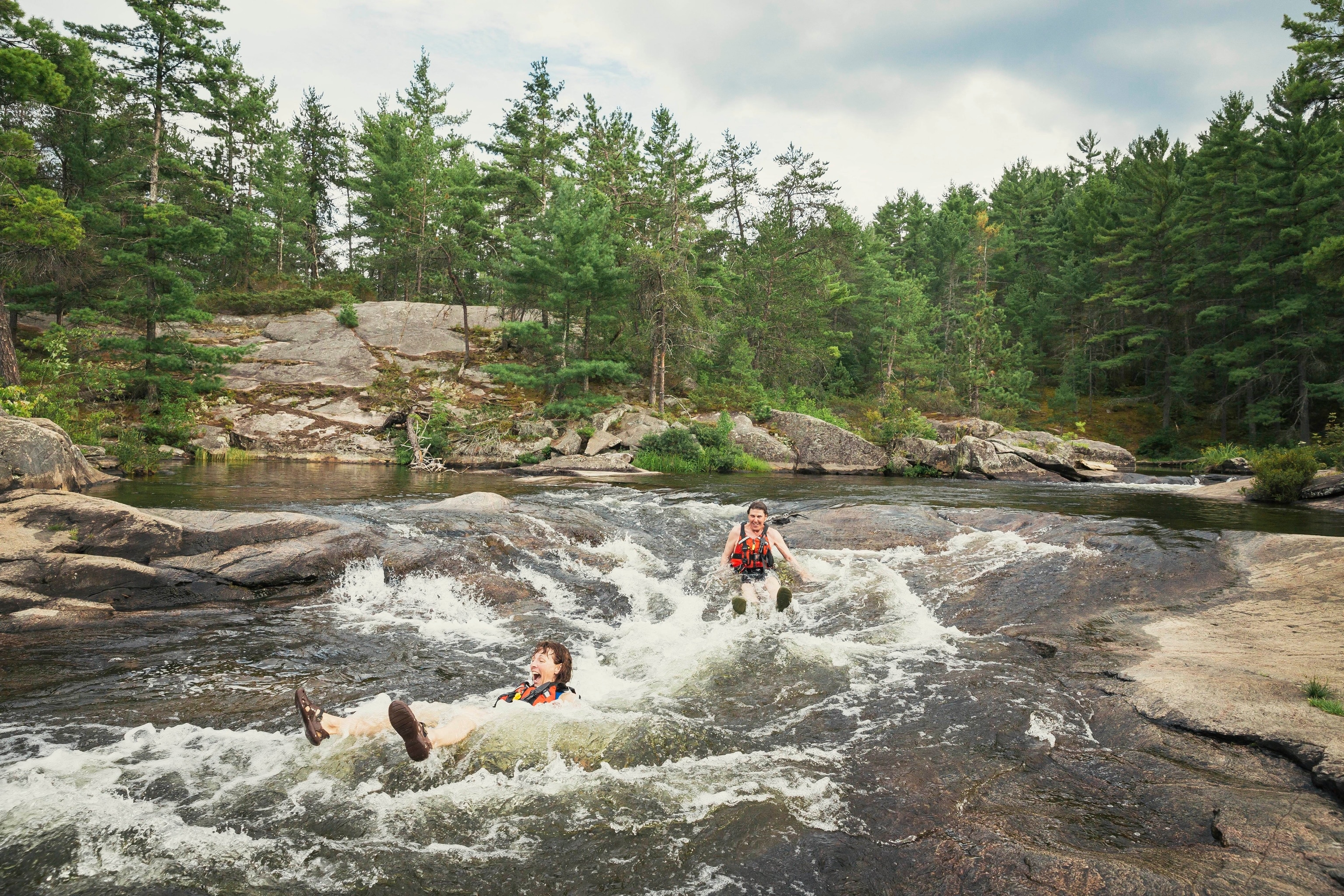 two people riding down one of the many rivers in Ontario