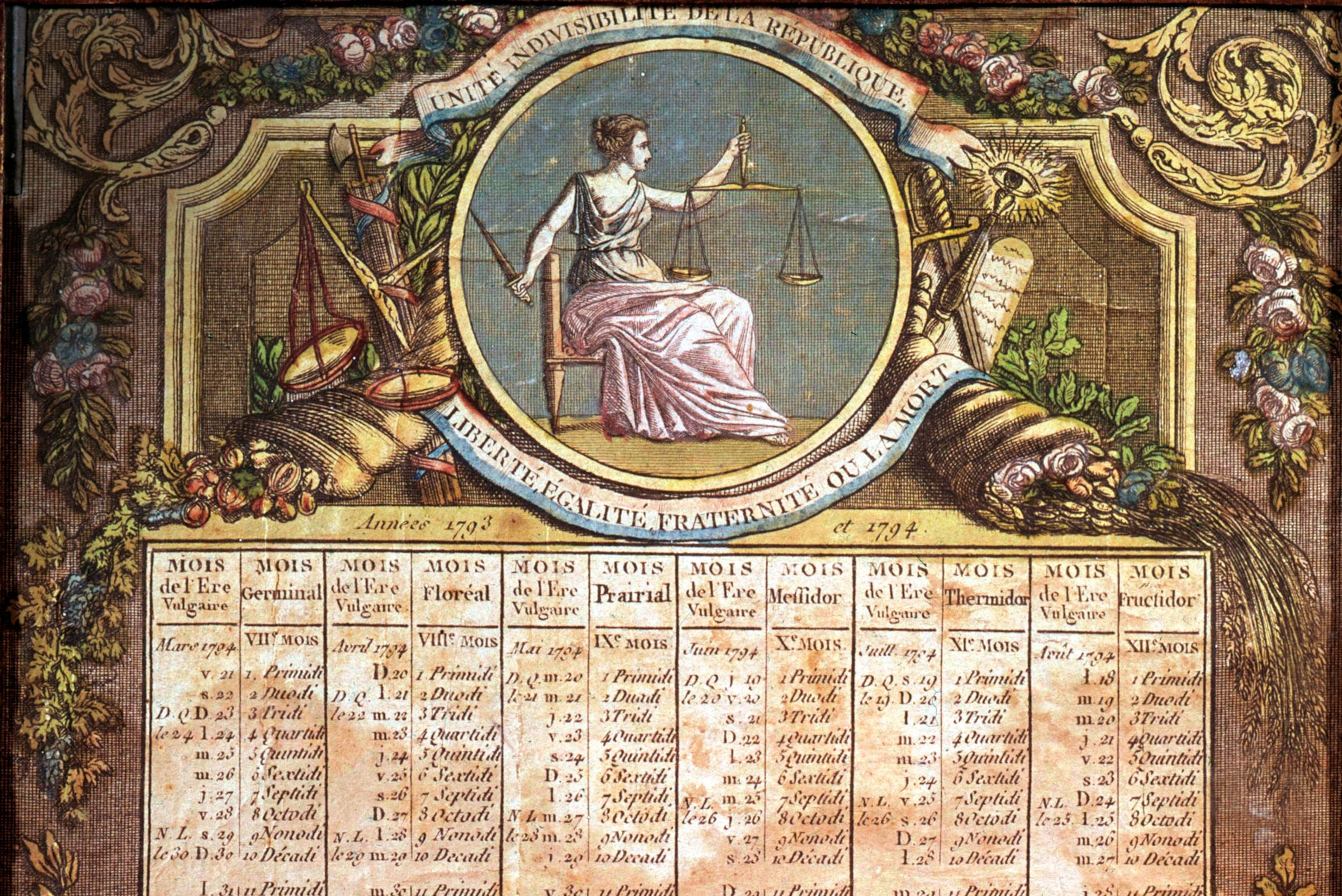 A drawing of an calendar with a woman holding scales at the top