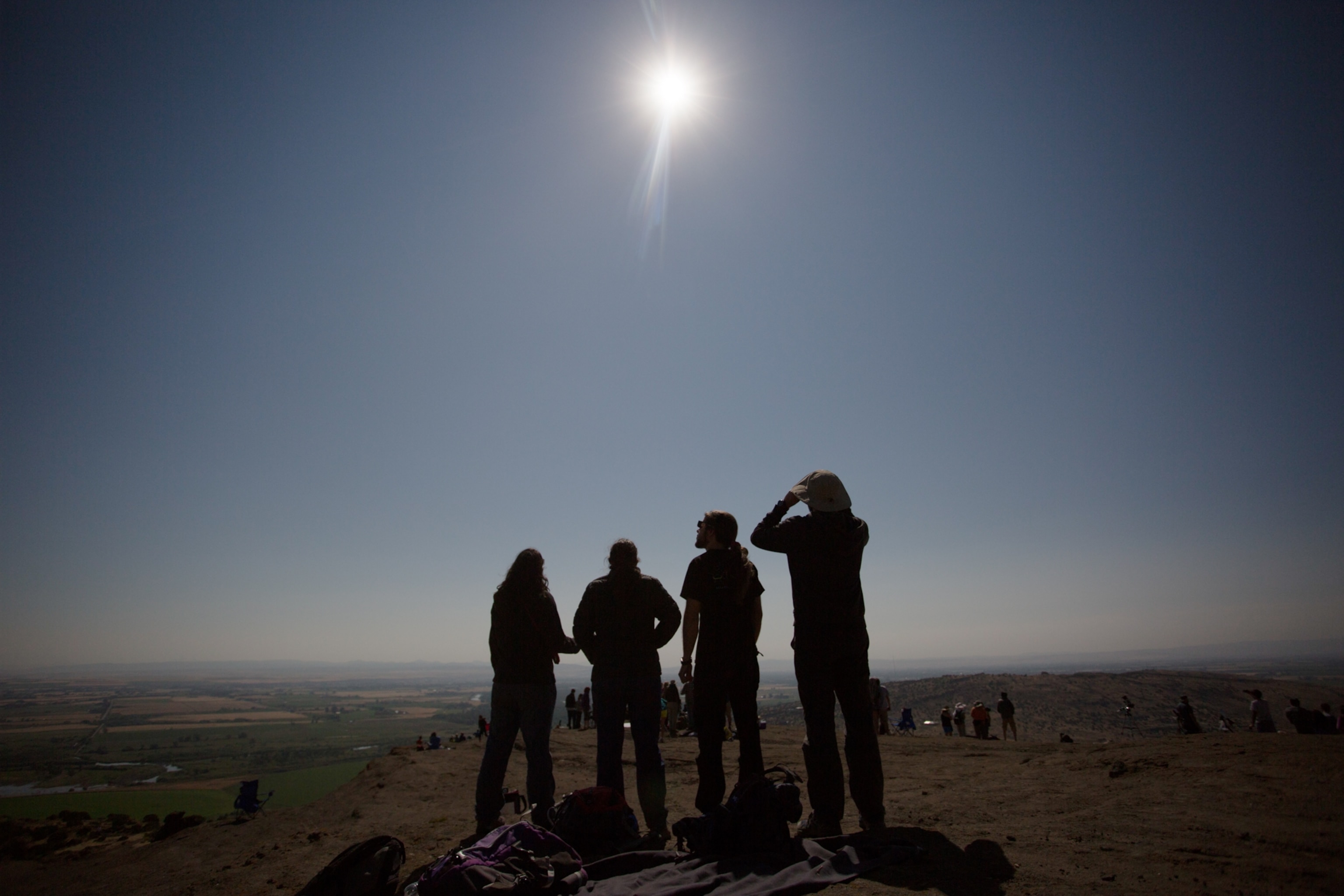 MENAN, ID - AUGUST 21: Friends from a nearby college watch the eclipse together on Menan Butte August 21, 2017 in Menan, Idaho. Millions of people have flocked to areas of the U.S. that are in the "path of totality" in order to experience a total solar eclipse.