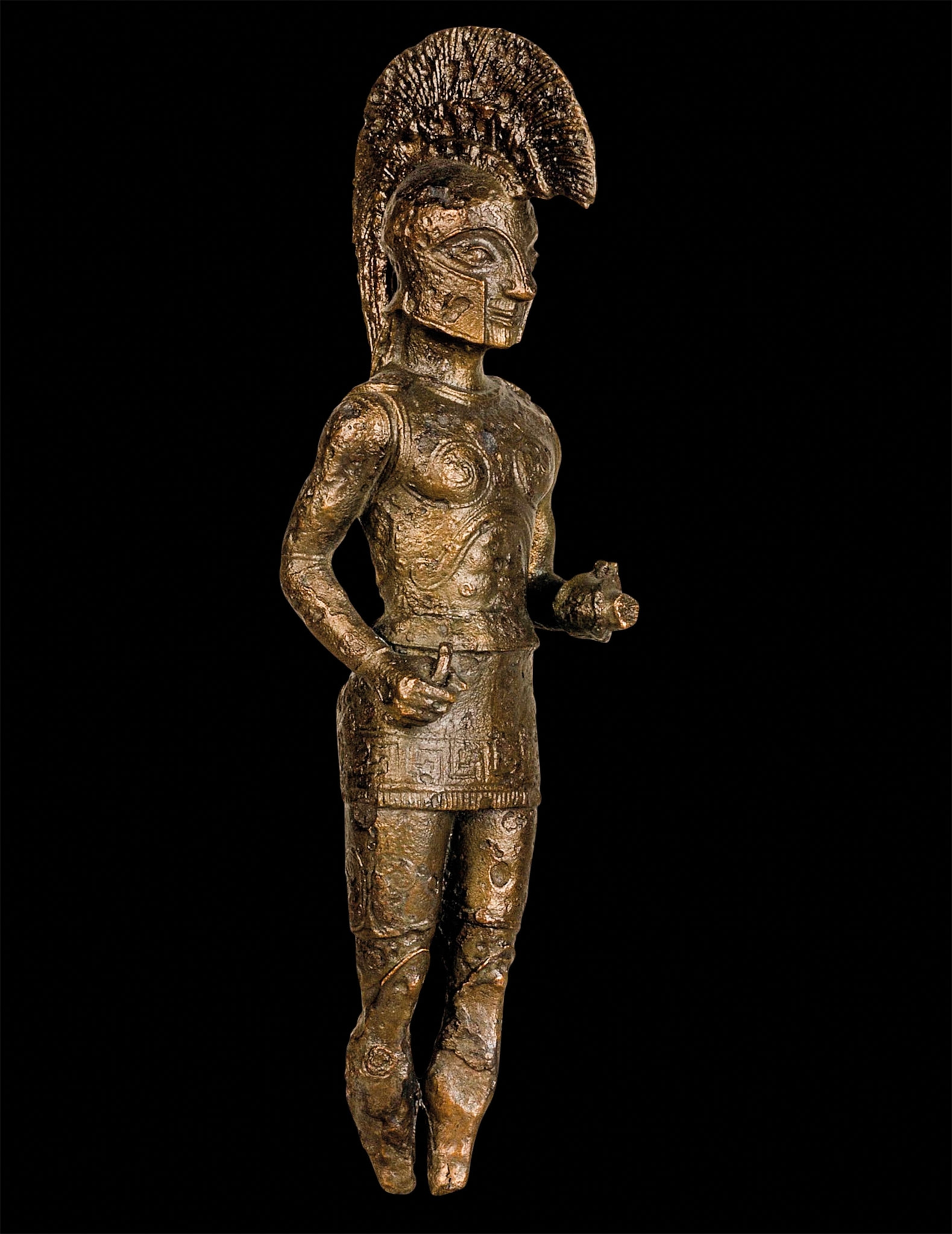 A bronze figurine of a Spartan warrior in armor