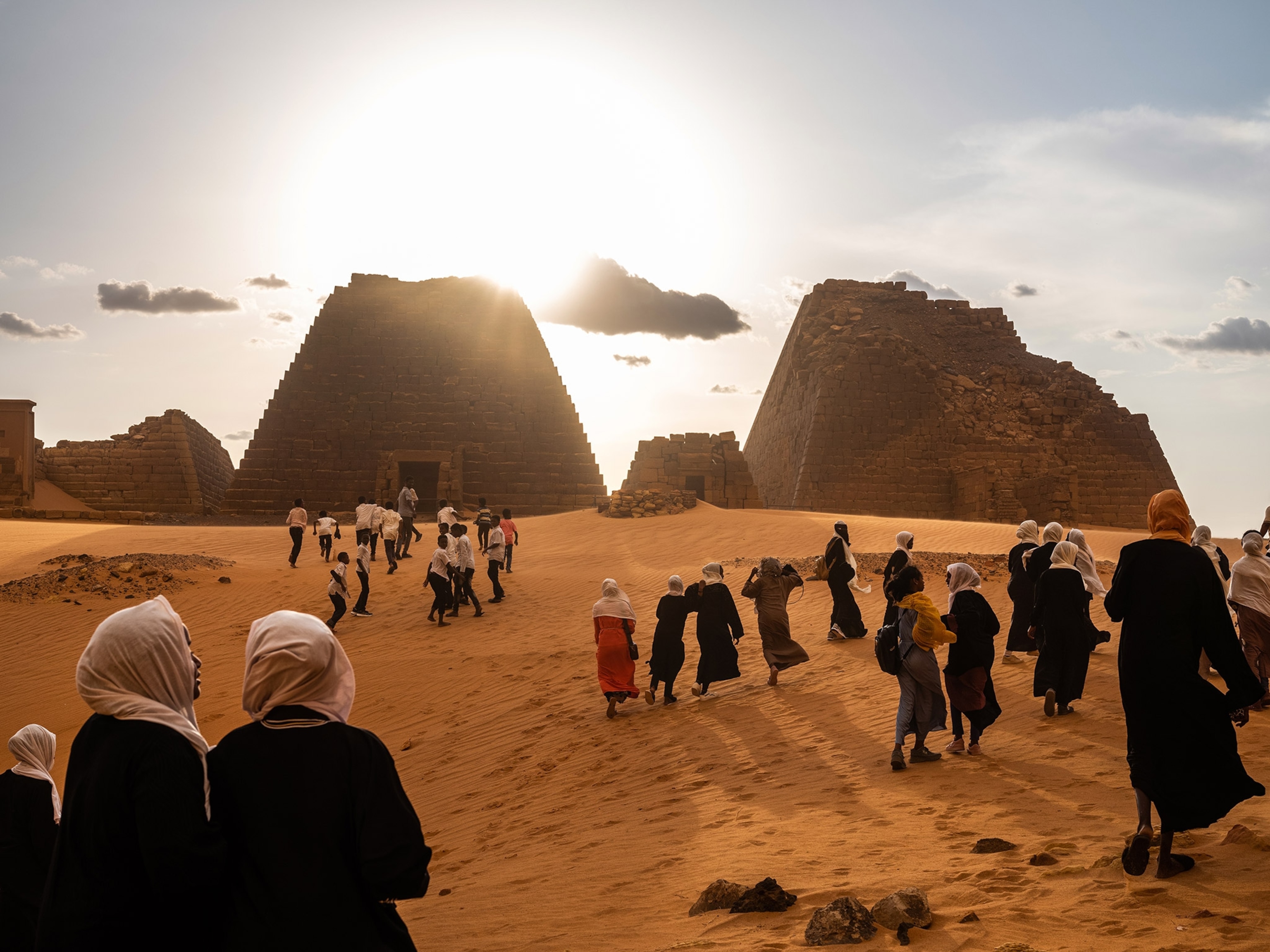 A haboob, or sandstorm, followed by a thunderstorm, rolls across the Meroë pyramids, Sudan, during a visit by a group of schoolchildren organized by “For Education” local youth volunteers