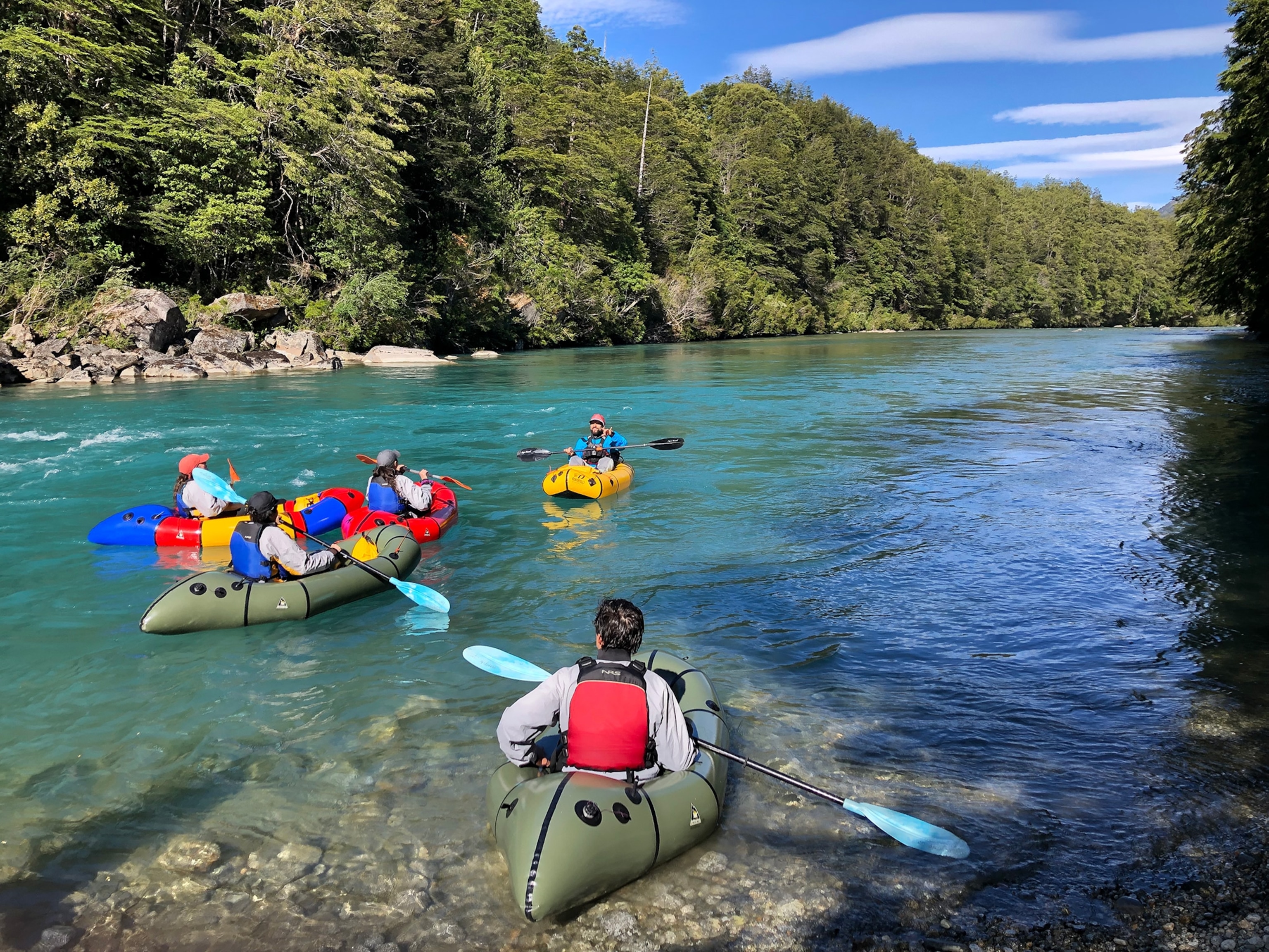A group of people rafting down the Ventisquero River.