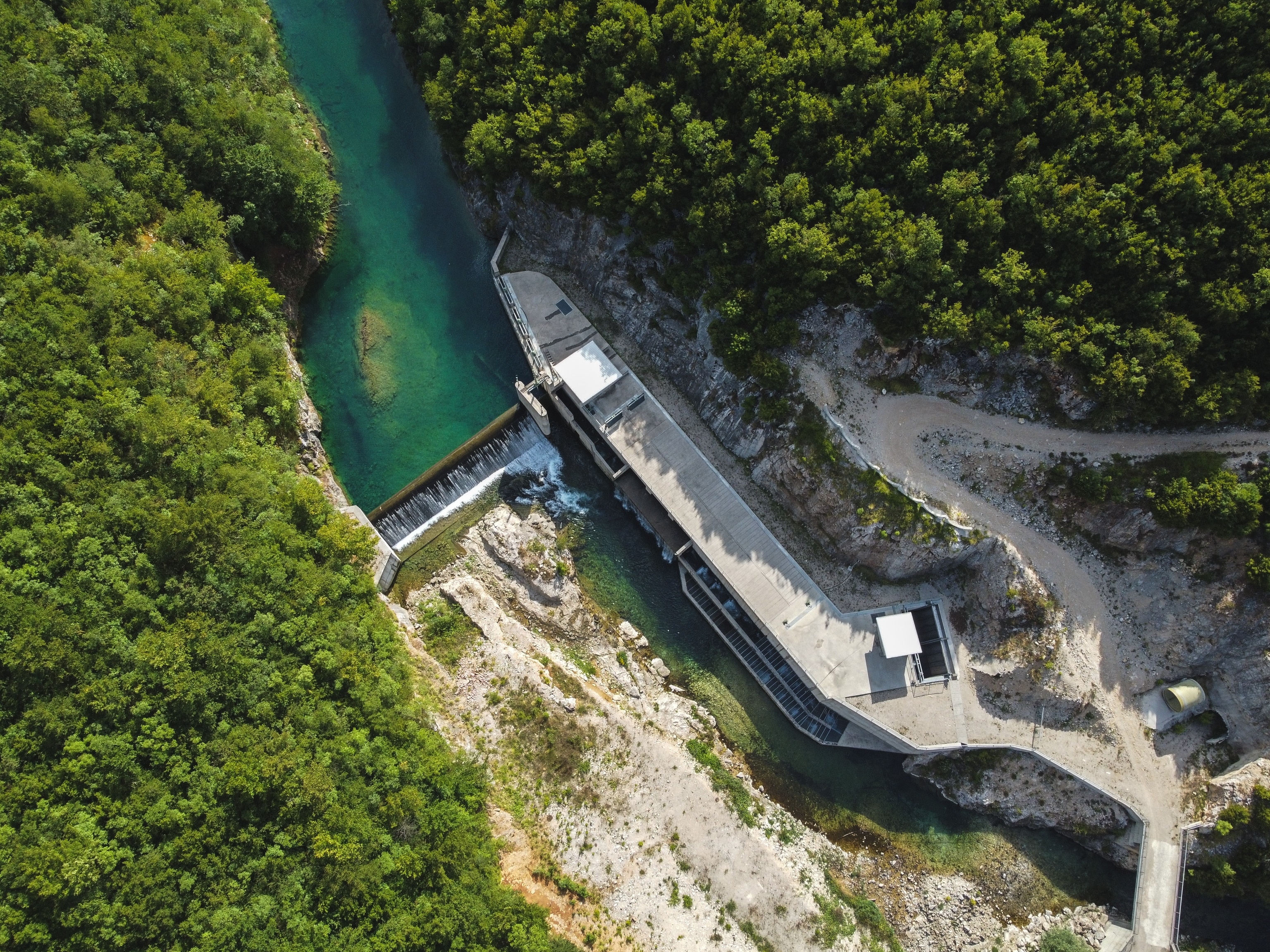 The Medna small hydropower dam, near the source of the Sana River. The dam came into operation in 2018, after years of fierce opposition from locals. Despite the spatial plan of Republika Srpska, the Bosnian-Serb entity of Bosnia & Herzegovina, envisioning the entire Upper Sana as a protected area, construction of the dam was allowed to commence without proper environmental or building permits. The dam was built by Austrian based developer, Kelag.
