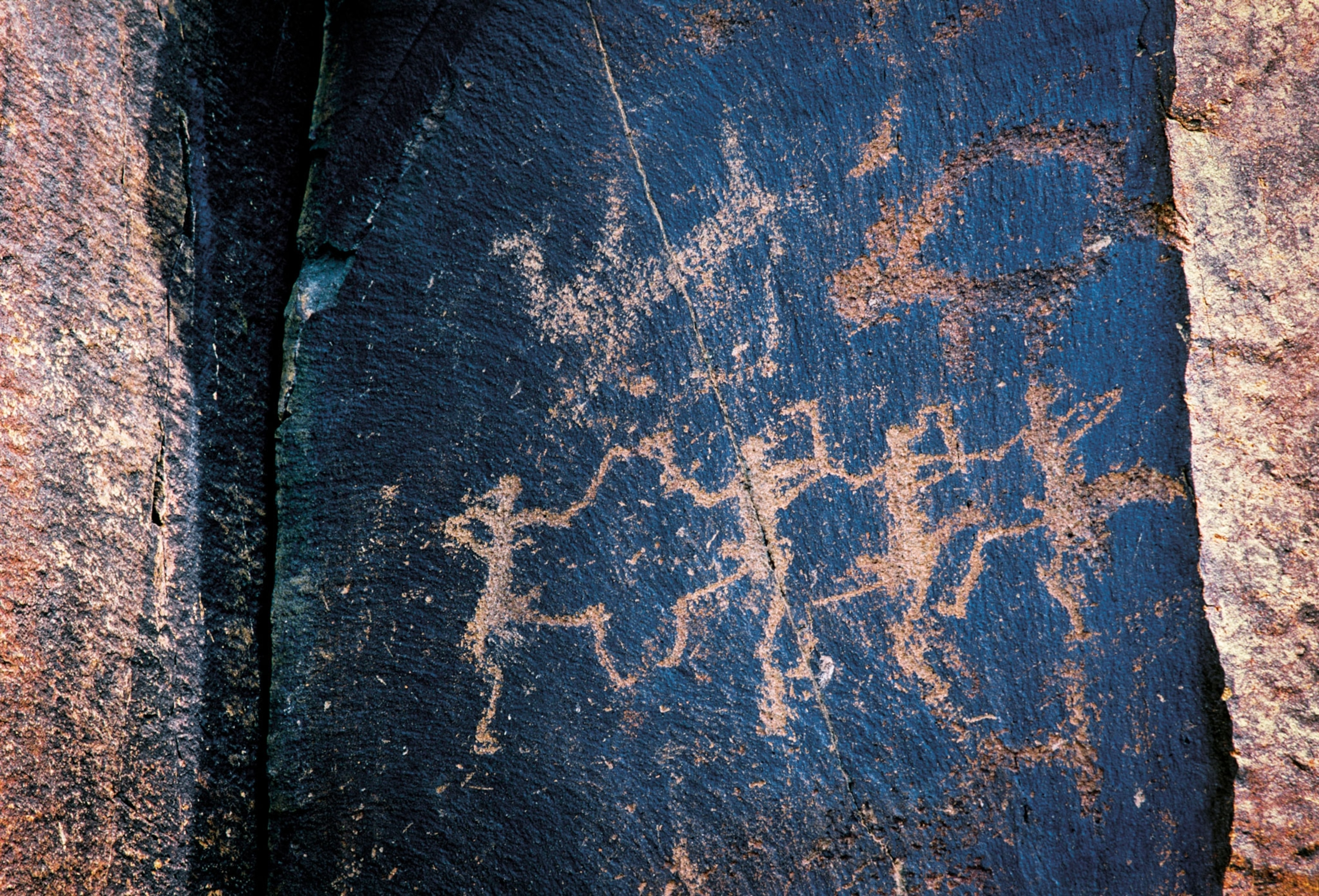 A drawing of people on a rock
