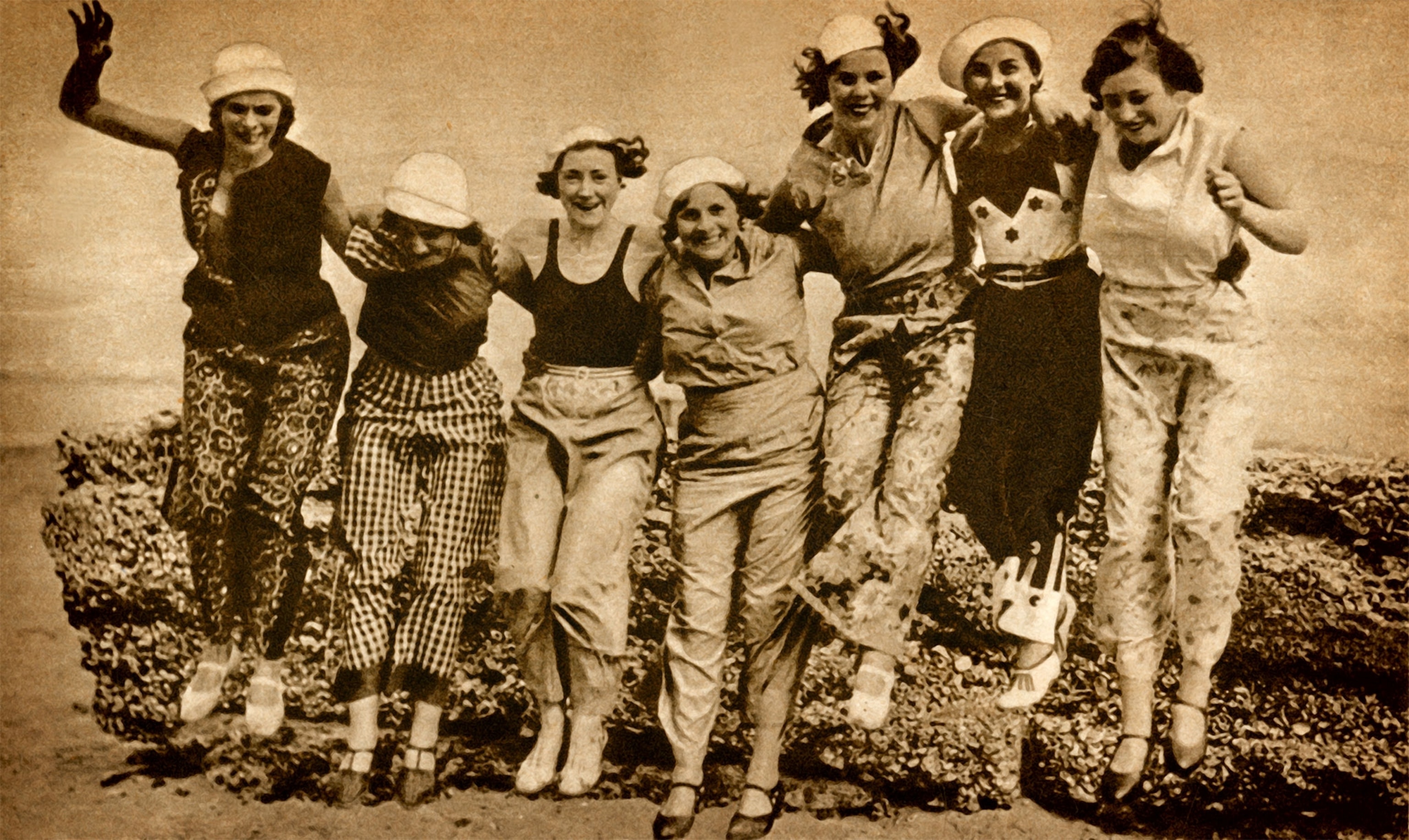 Women in beach pajamas and sailor caps gather in a 1933 photograph