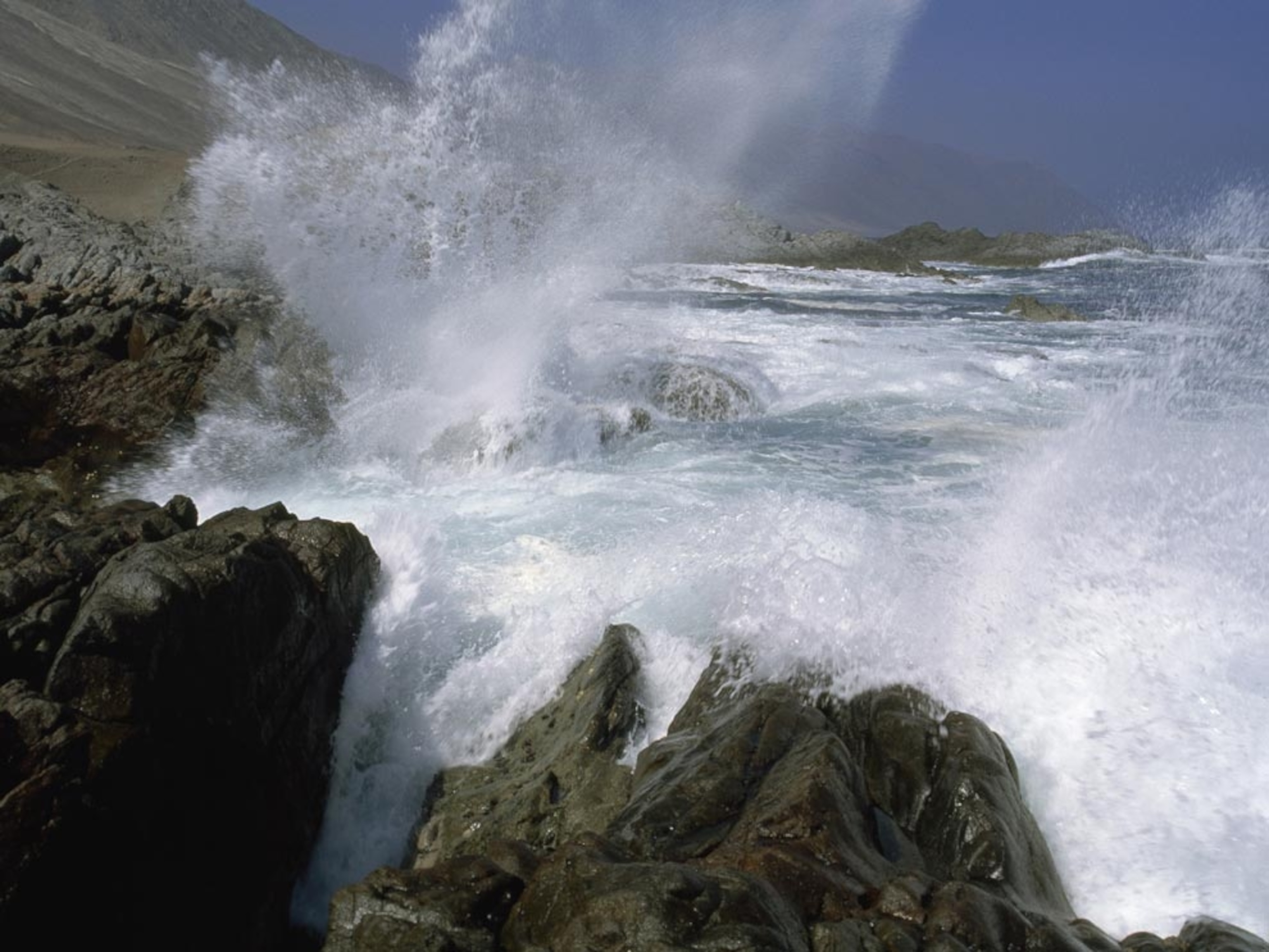 Waves crashing against Chile coast
