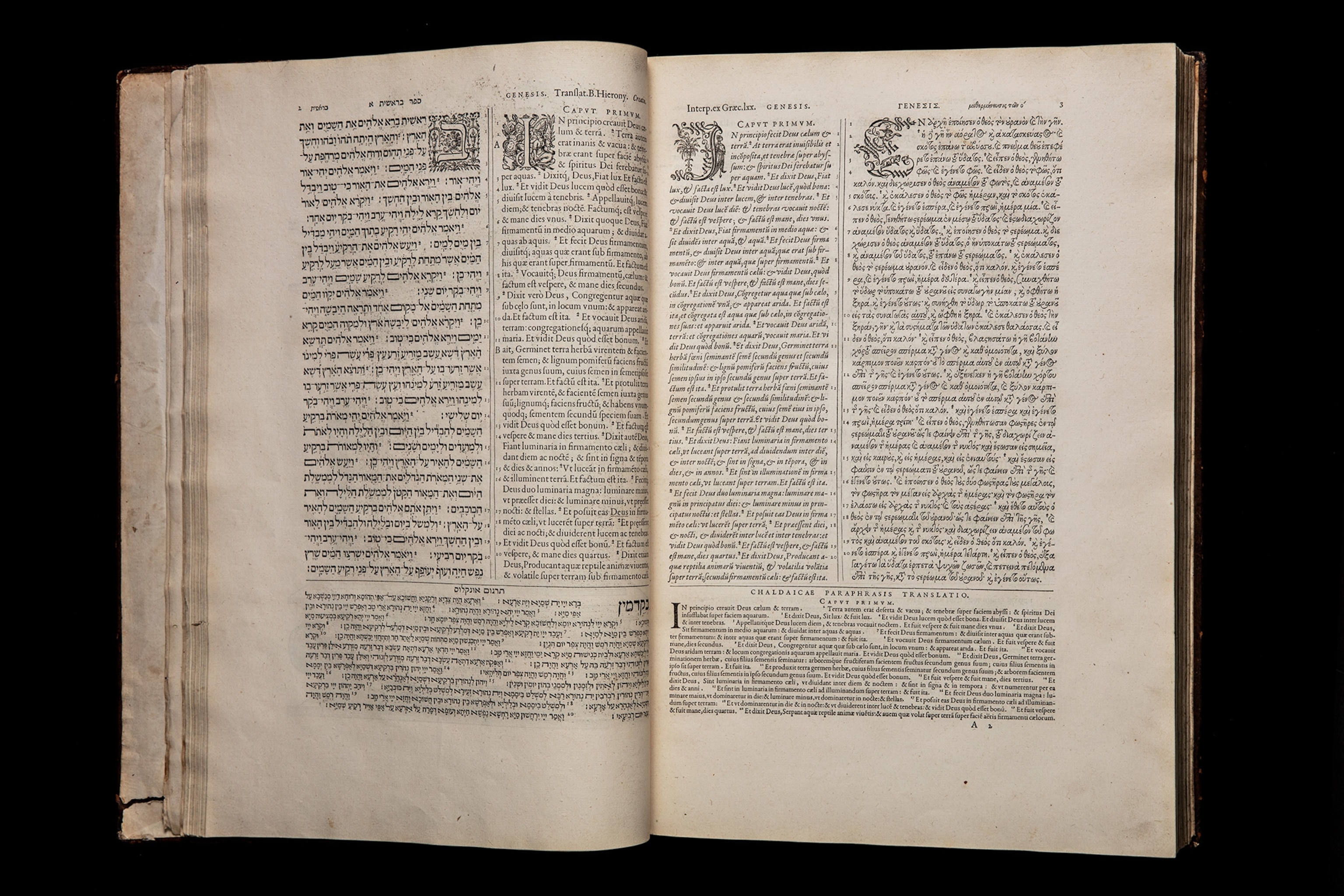 opened spread of Bible in Hebrew, Greek, Aramaic, and Latin