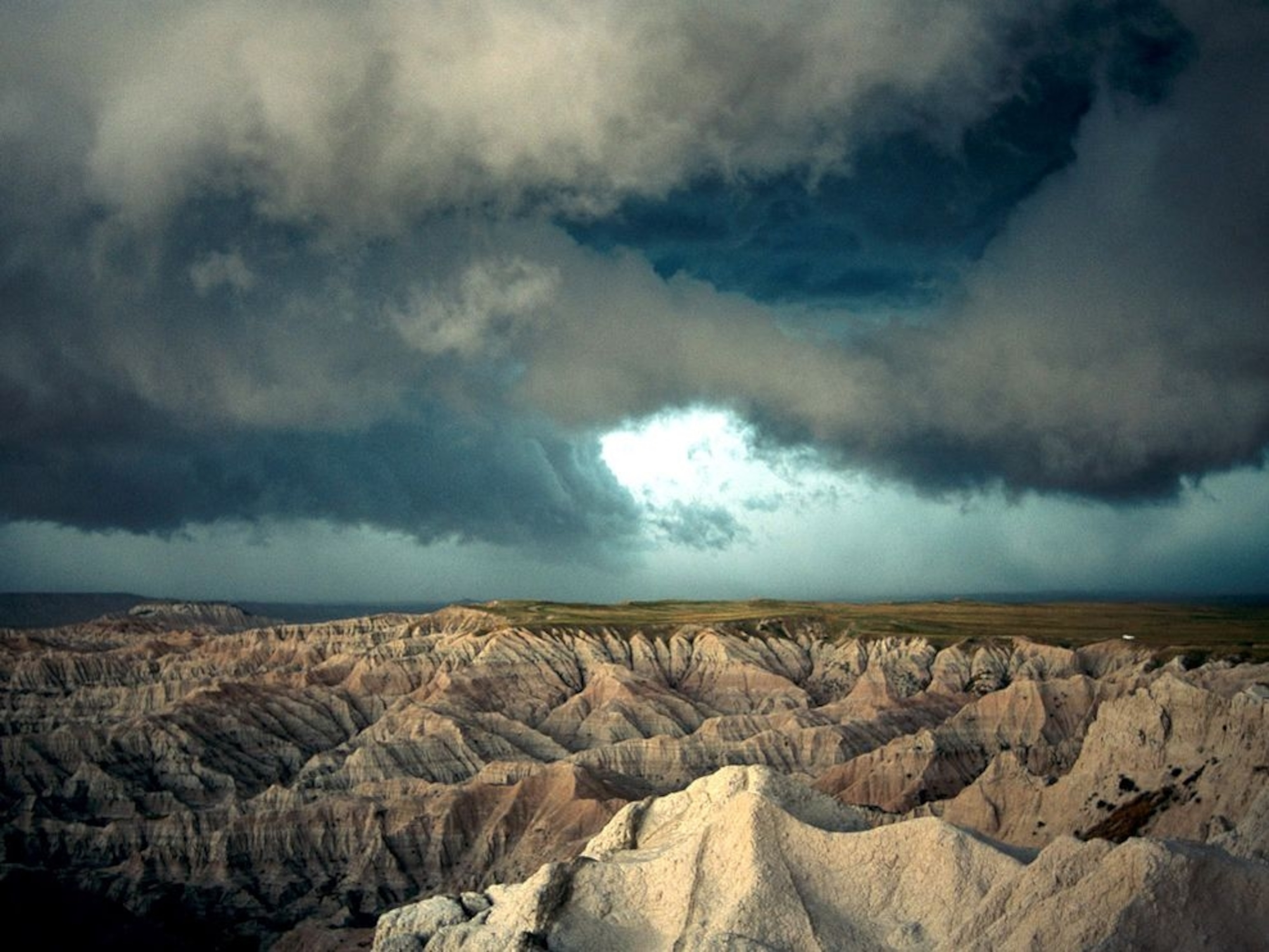 storm clouds over cliffs and prairie