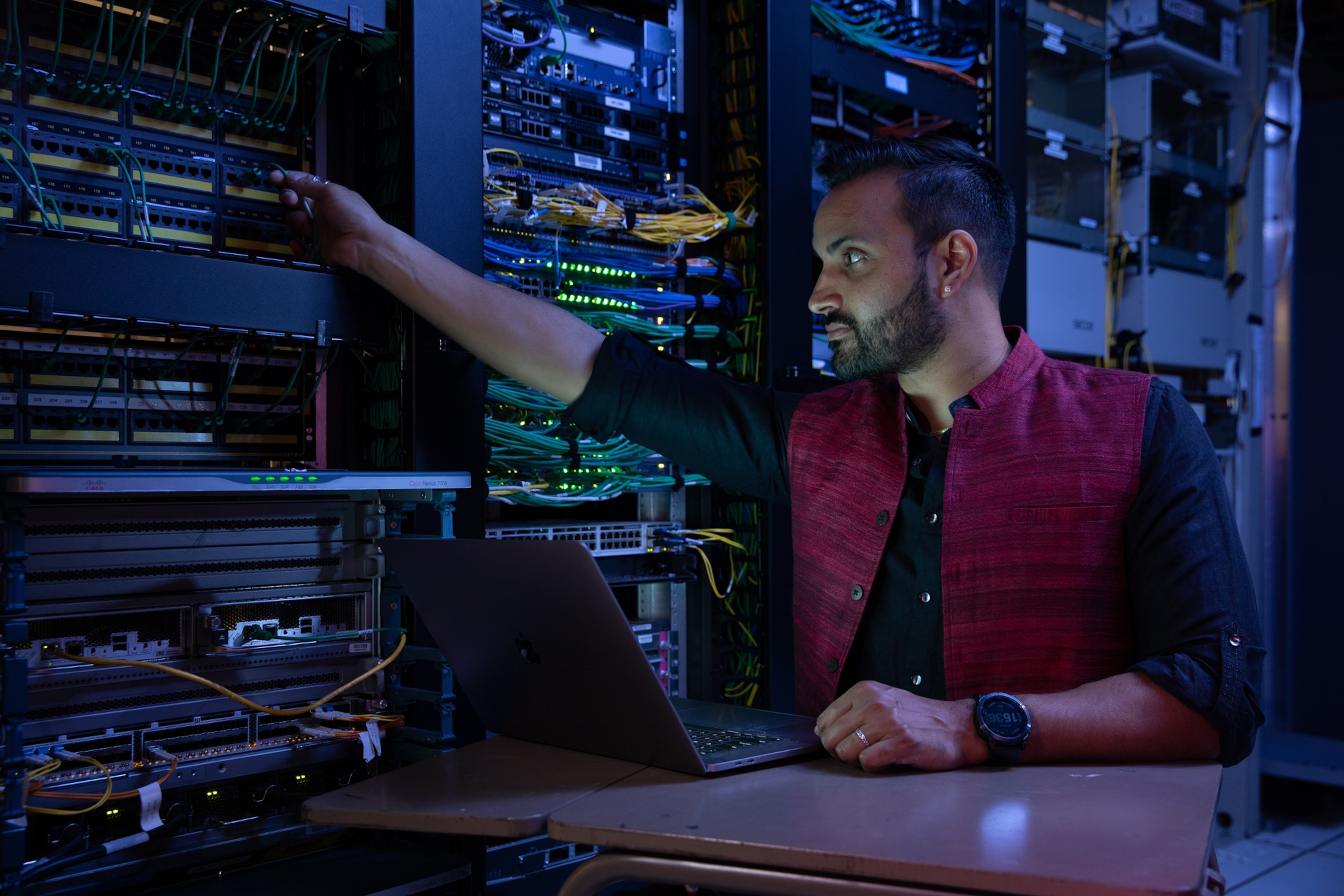 Picture of man in control center.